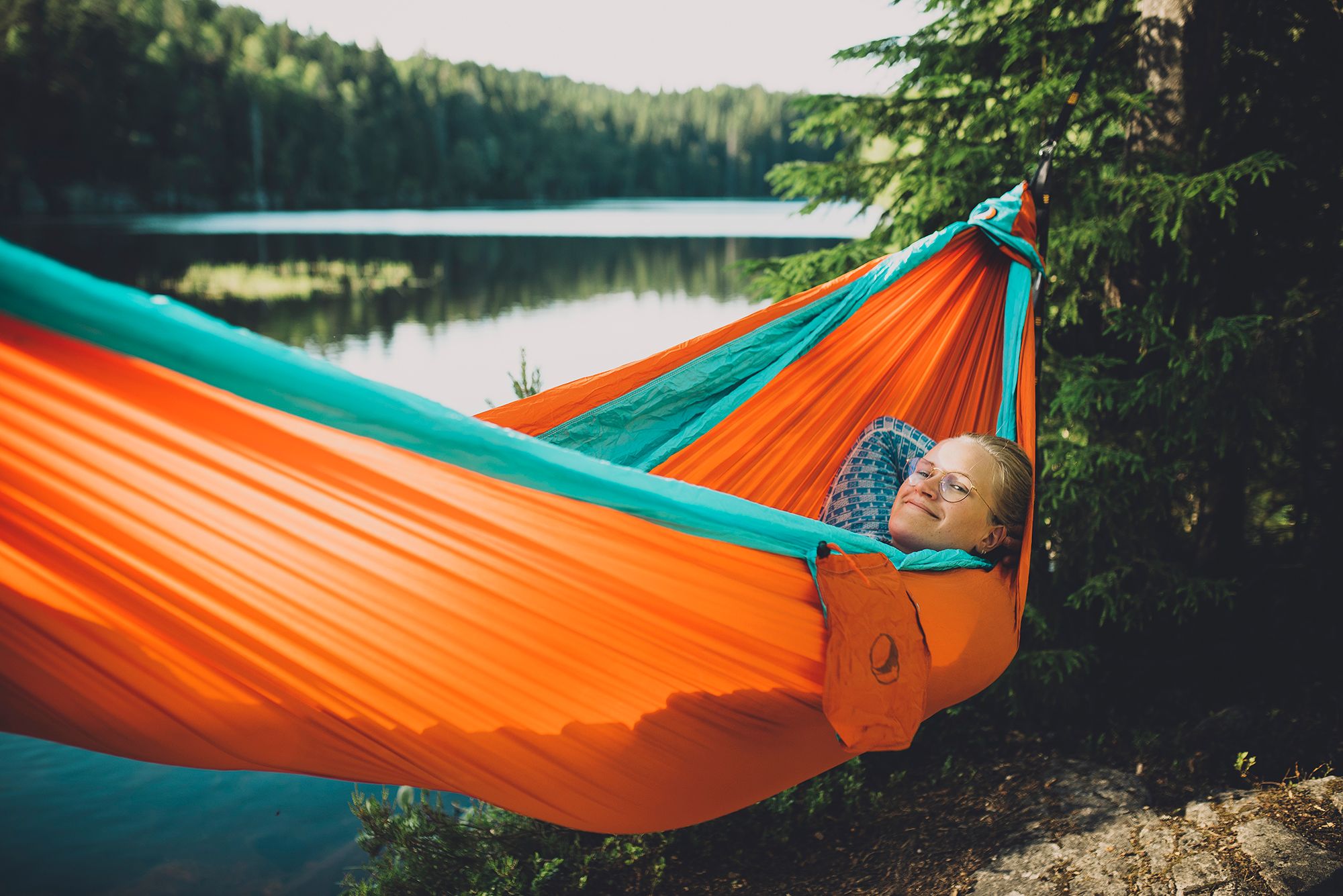 Woman in hammock in Nordmarka forest in Oslo, Eastern Norway