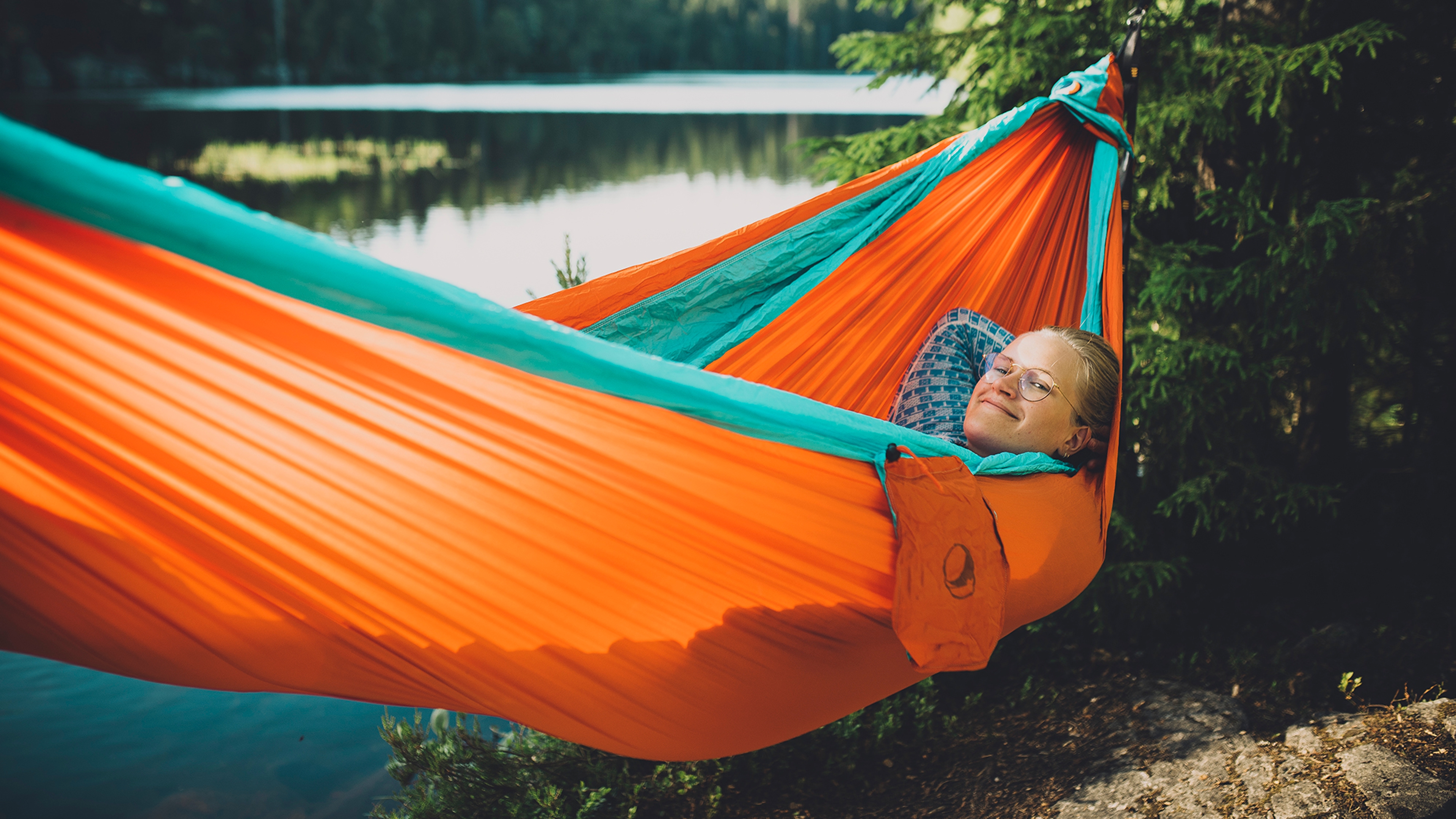Woman in hammock in Nordmarka forest in Oslo, Eastern Norway