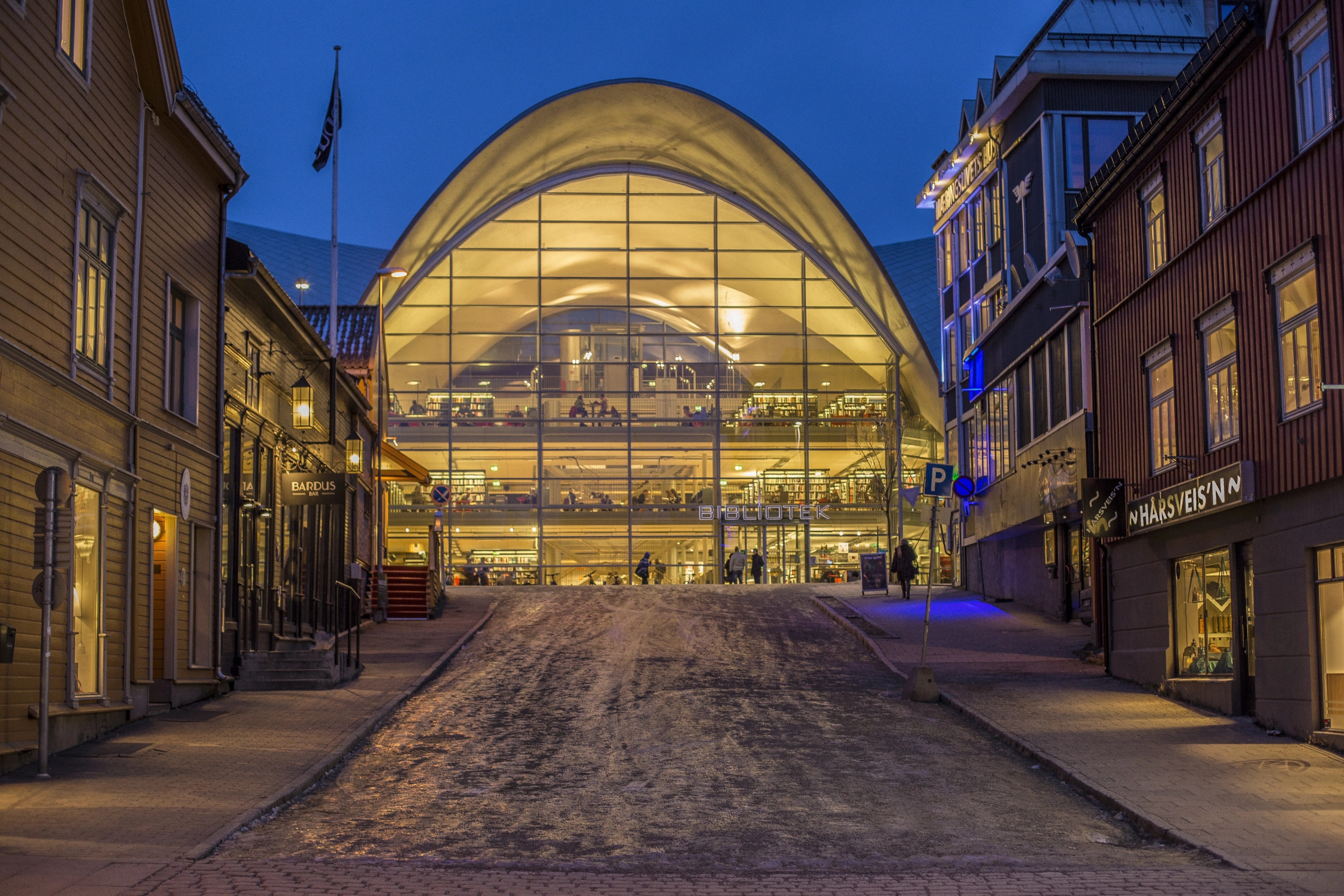 View from the outside of the city library and archive Tromsø bibliotek og byarkiv in the dark, Tromsø, Northern Norway