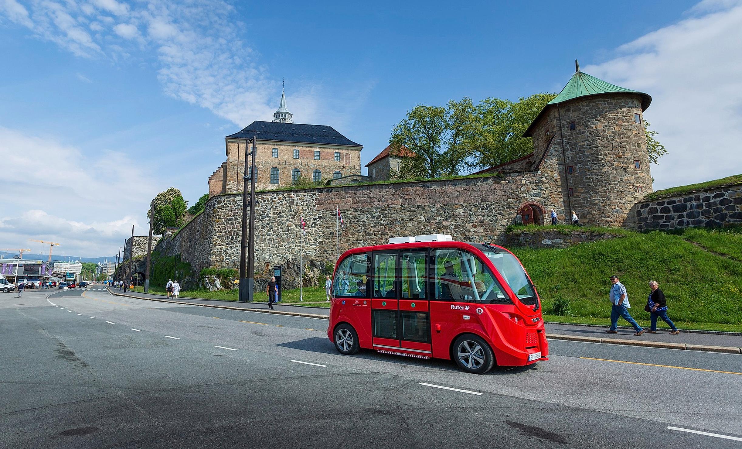 Electric bus from Ruter in front of the Akershus fortress in Oslo, Norway