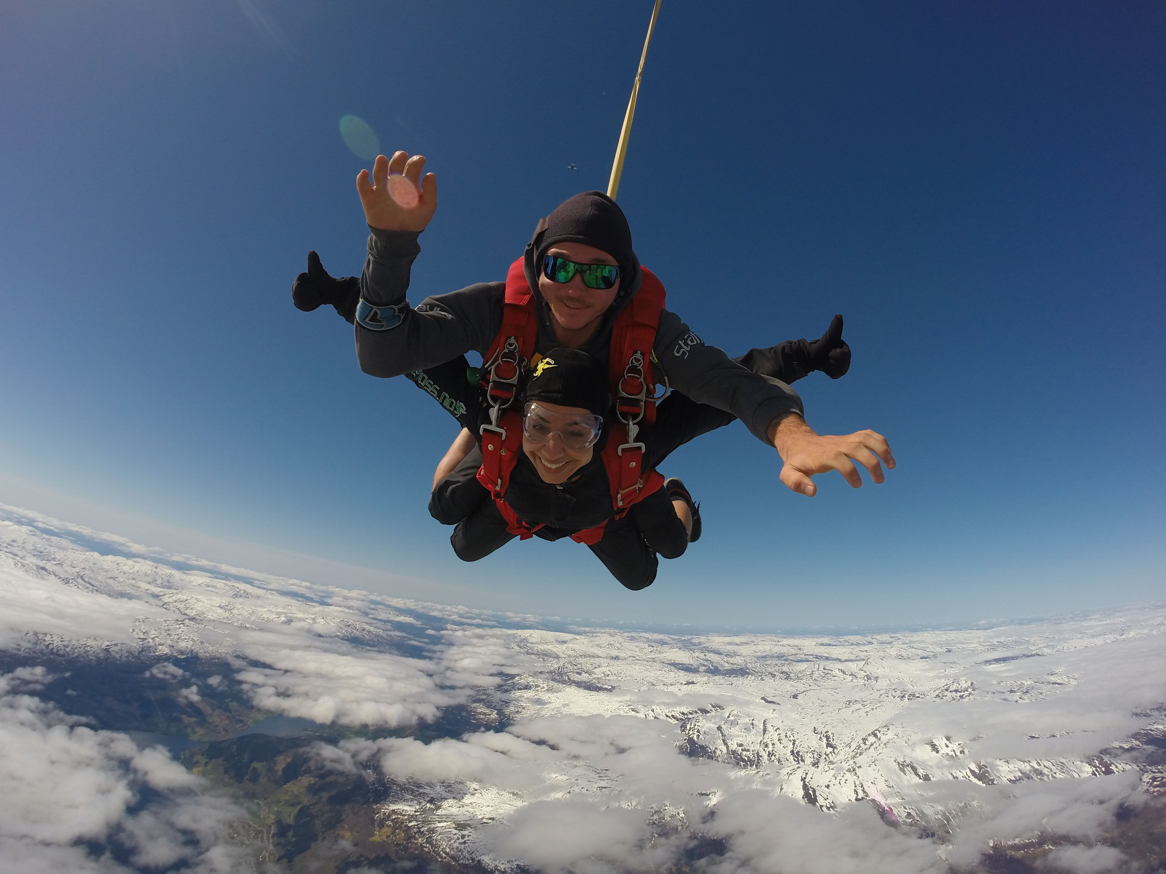 Two people tandem skydiving in Voss