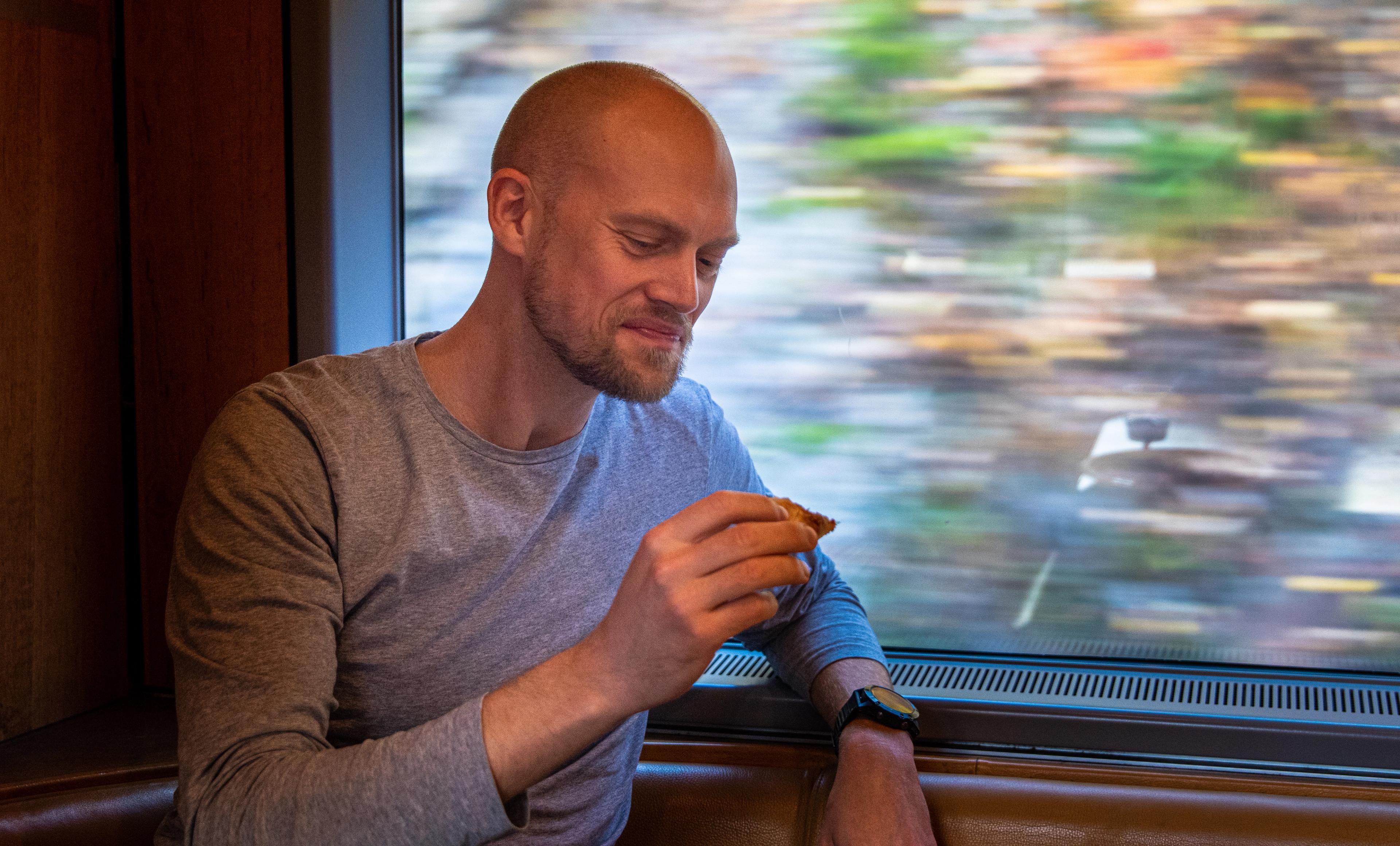 A man sitting in the cafe at the Dovre Railway