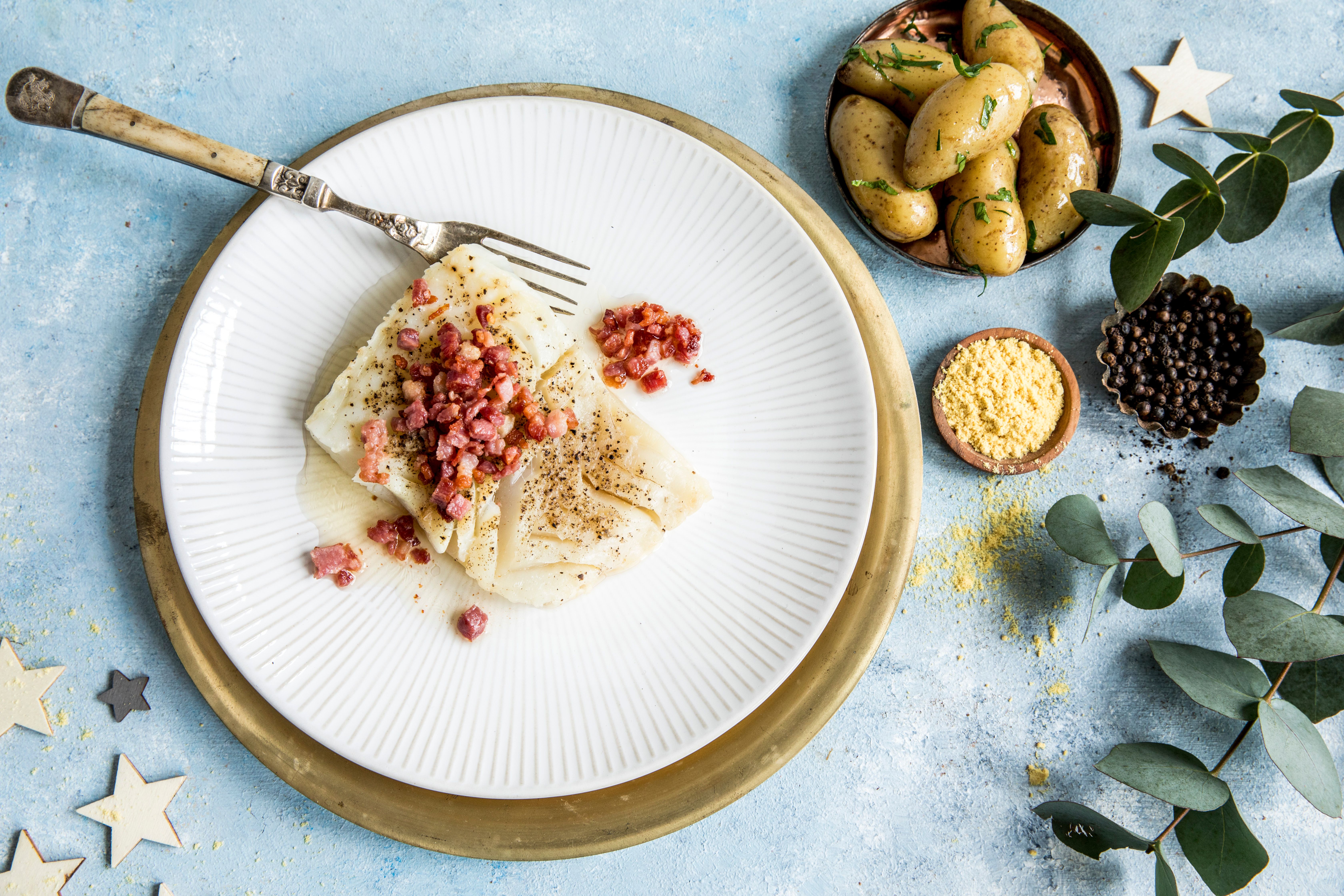 Plate of lutefisk with bacon and potatoes in Norway