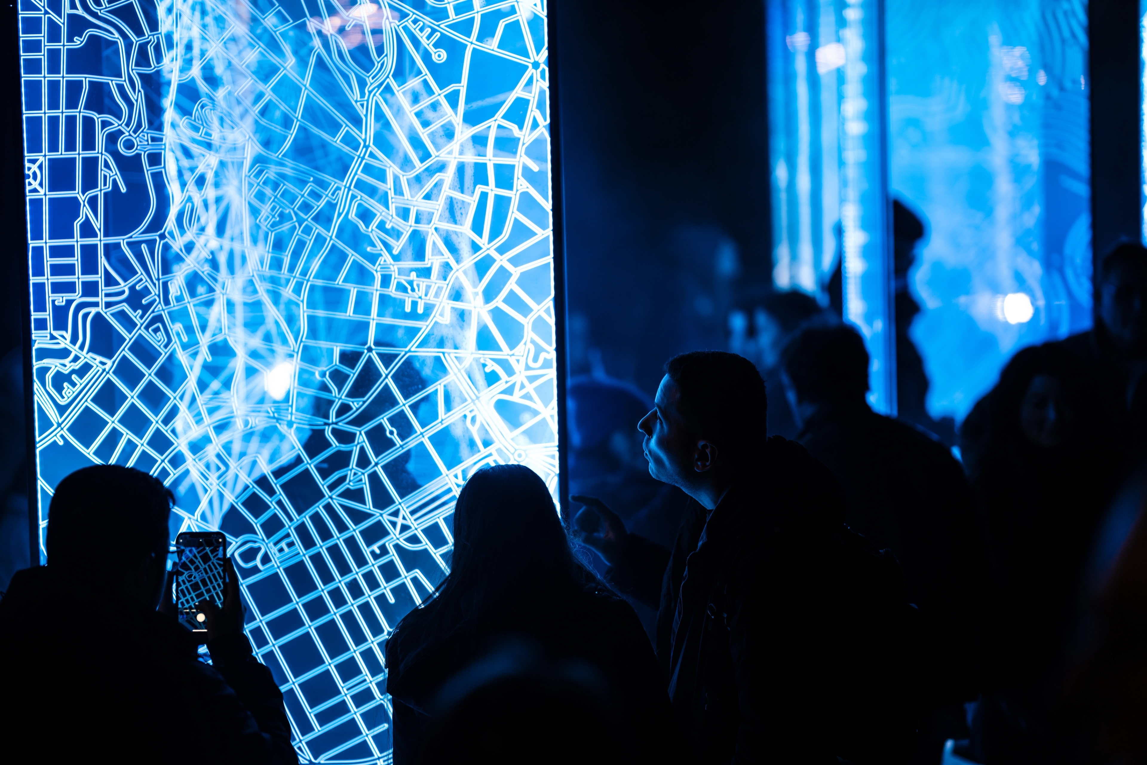 People looking at light art at FjordOslo light art festival 2022 in Oslo