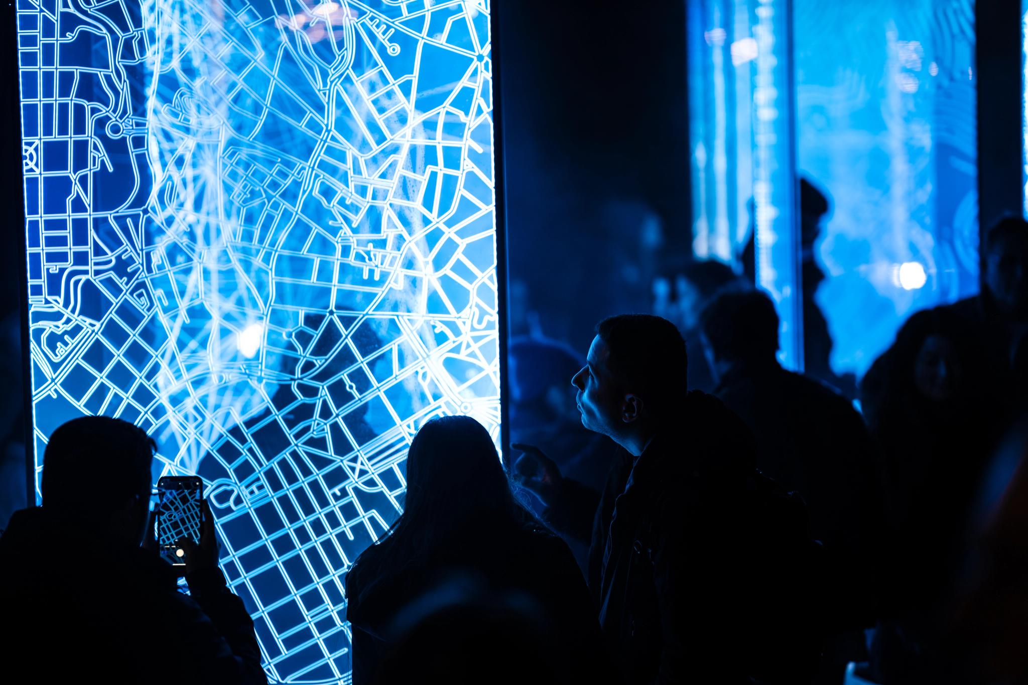 People looking at light art at FjordOslo light art festival 2022 in Oslo