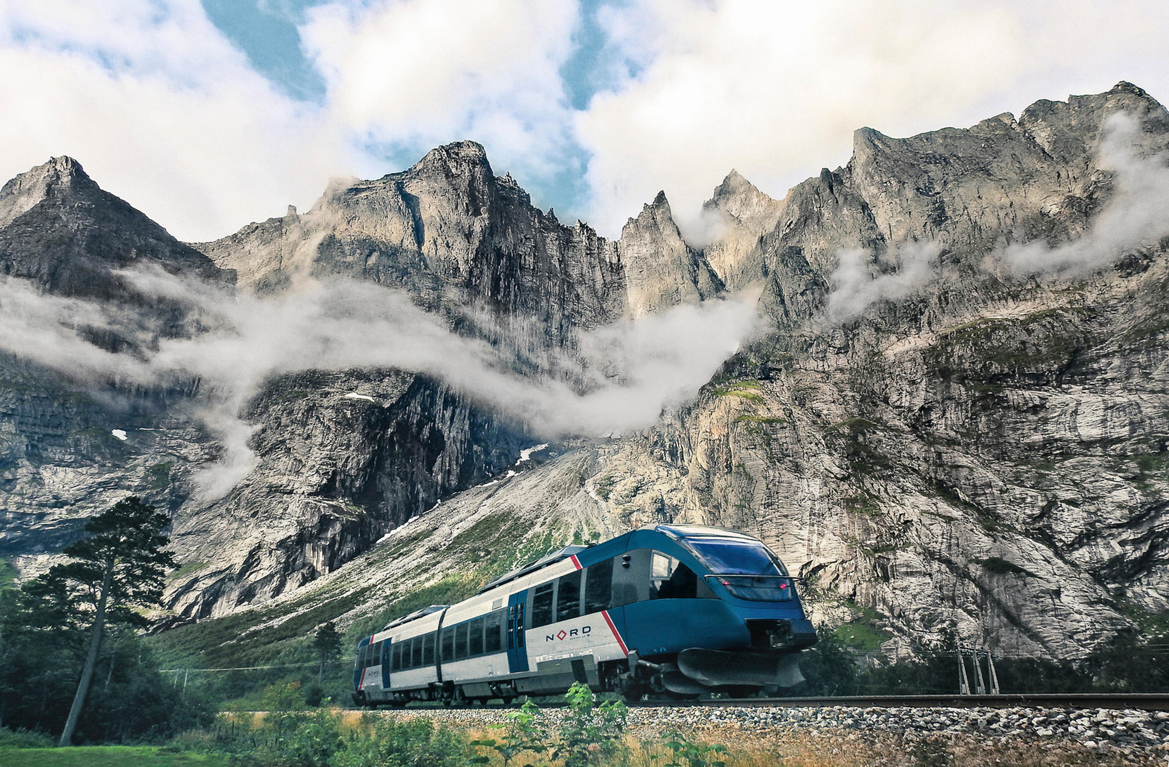 The Rauma train passing the Trollveggen mountain range