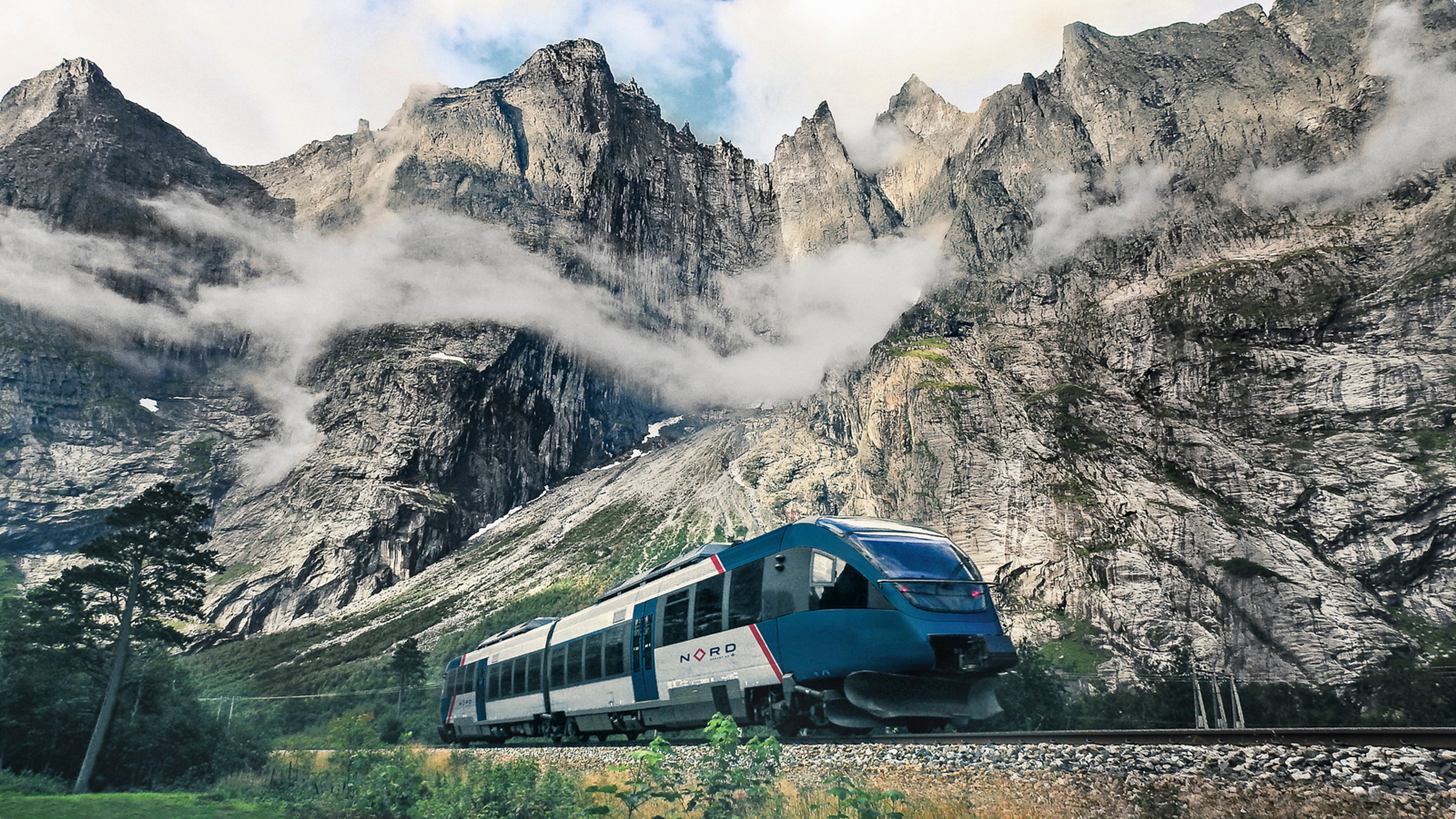 The Rauma train passing the Trollveggen mountain range