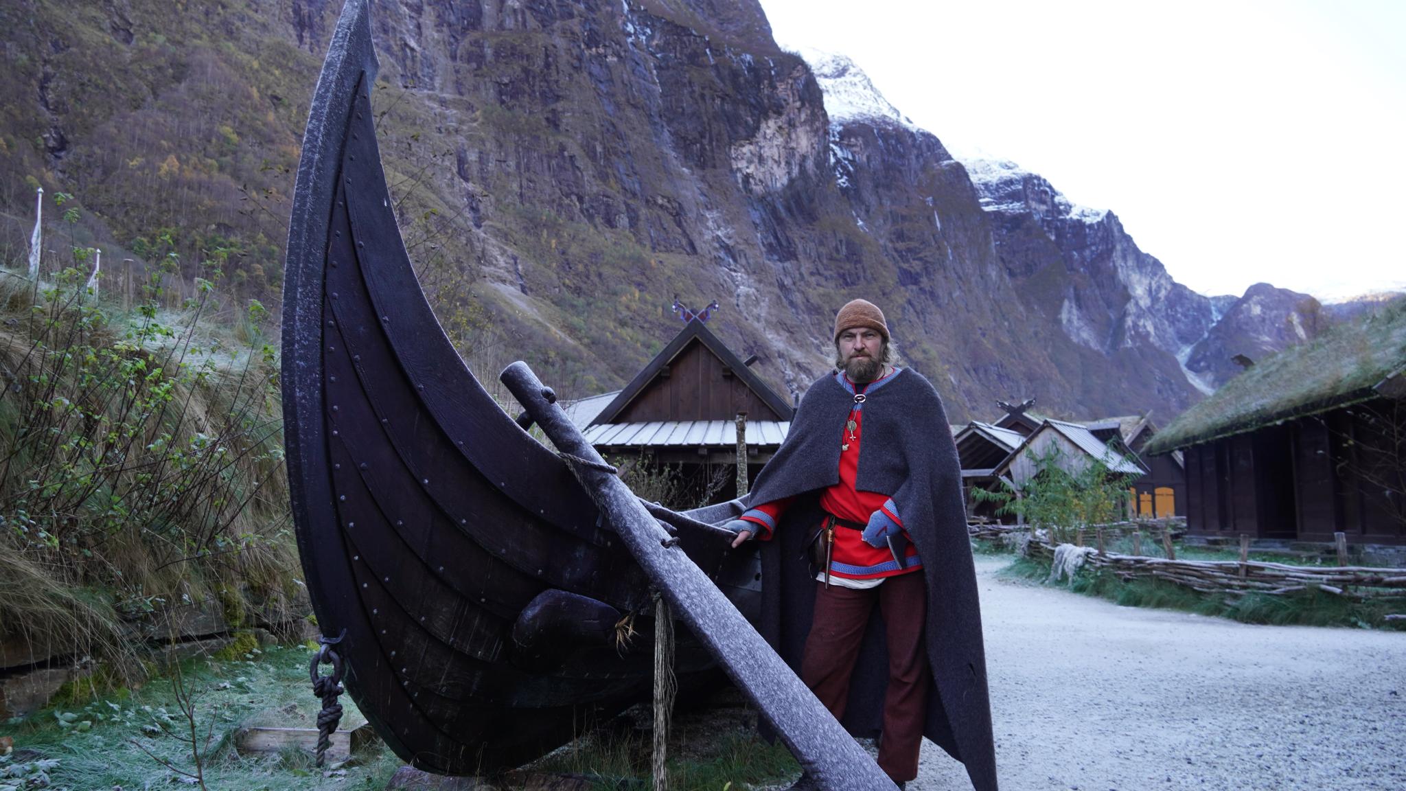 Viking in front of a viking ship in Viking Village in Gudvangen