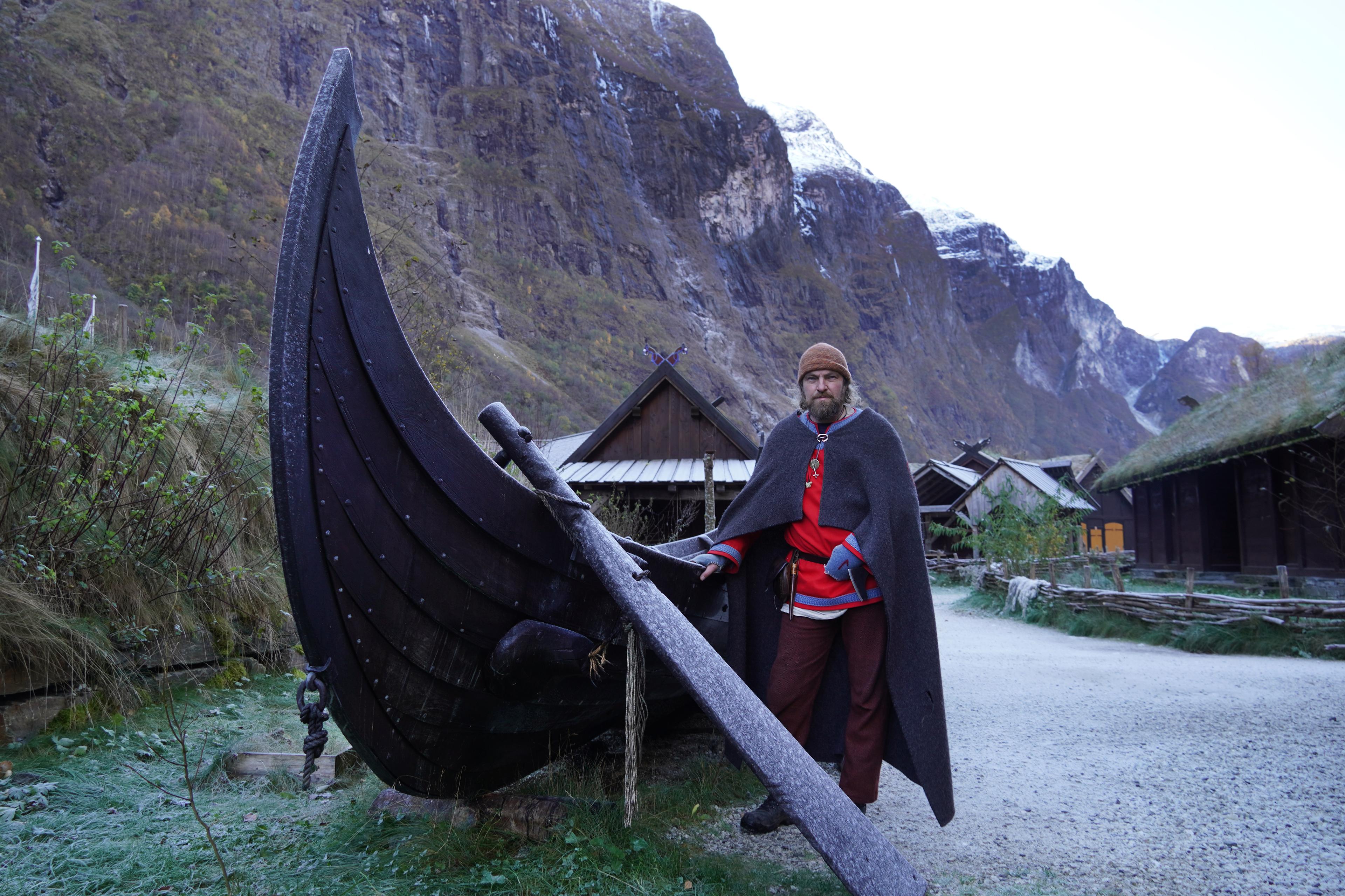 Viking in front of a viking ship in Viking Village in Gudvangen