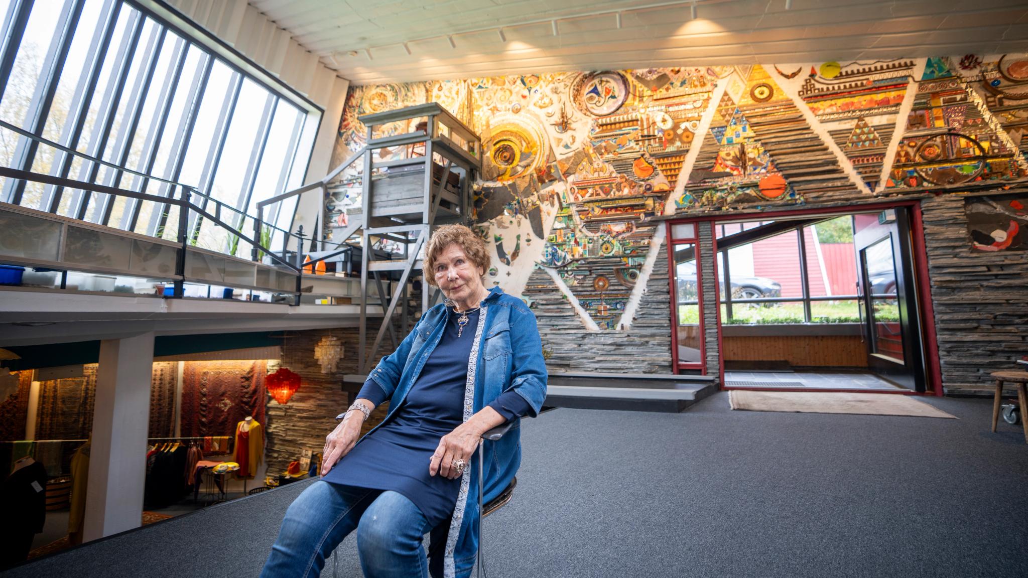 Regine Juhls in front of her mosaic at Juhls Silver Gallery