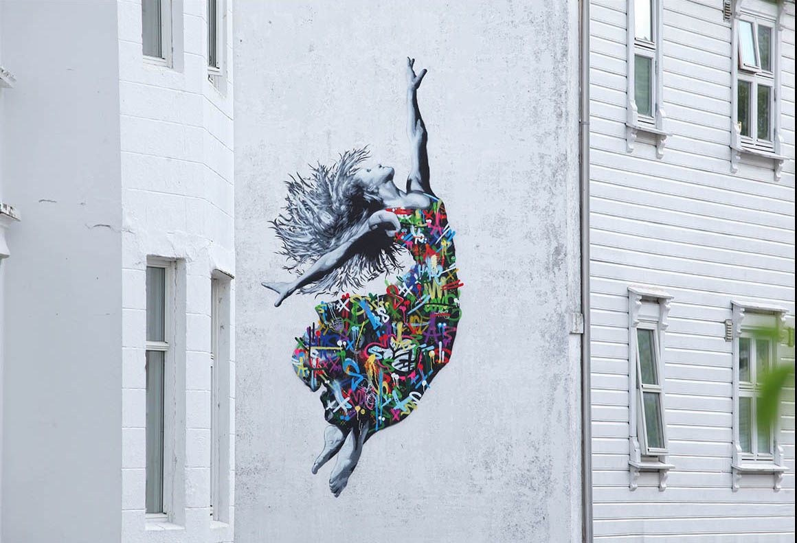 Street art of a woman in a colourful dress by Martin Whatson, Stavanger in Fjord Norway