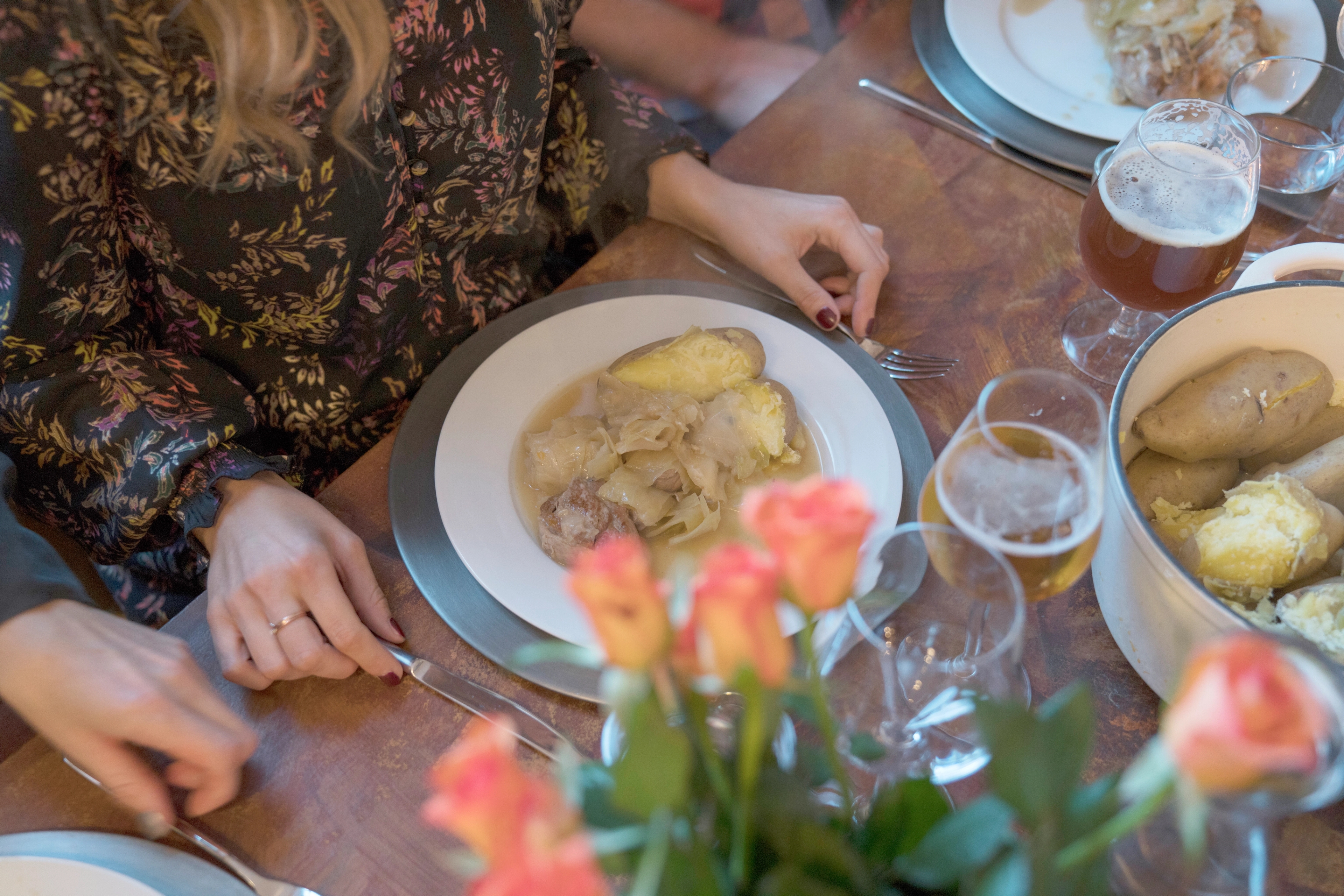 A plate of fårikål lamb stew at a dinner table in Oslo, Eastern Norway