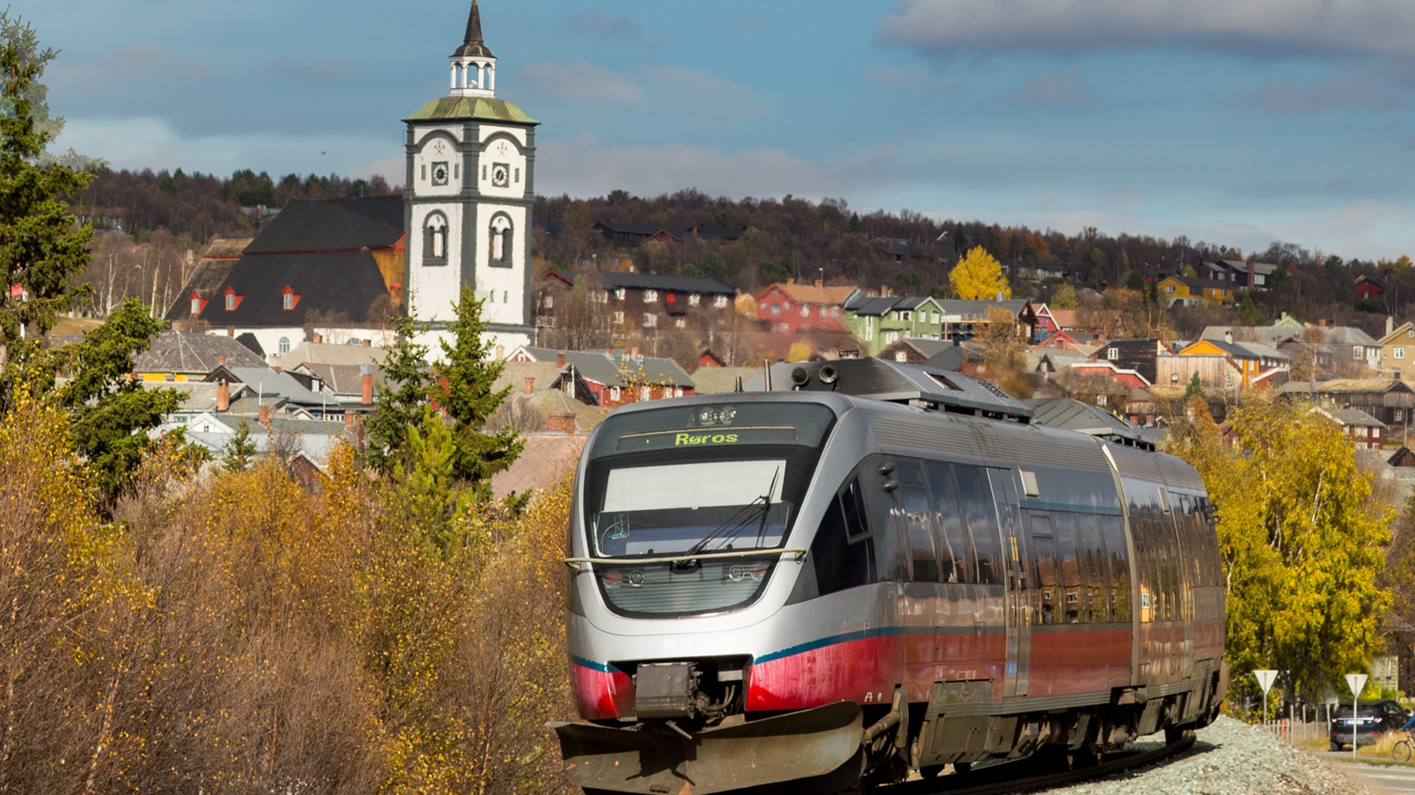 A train on the Rørosbanen with a view on the town of Røros, Trøndelag, Norway