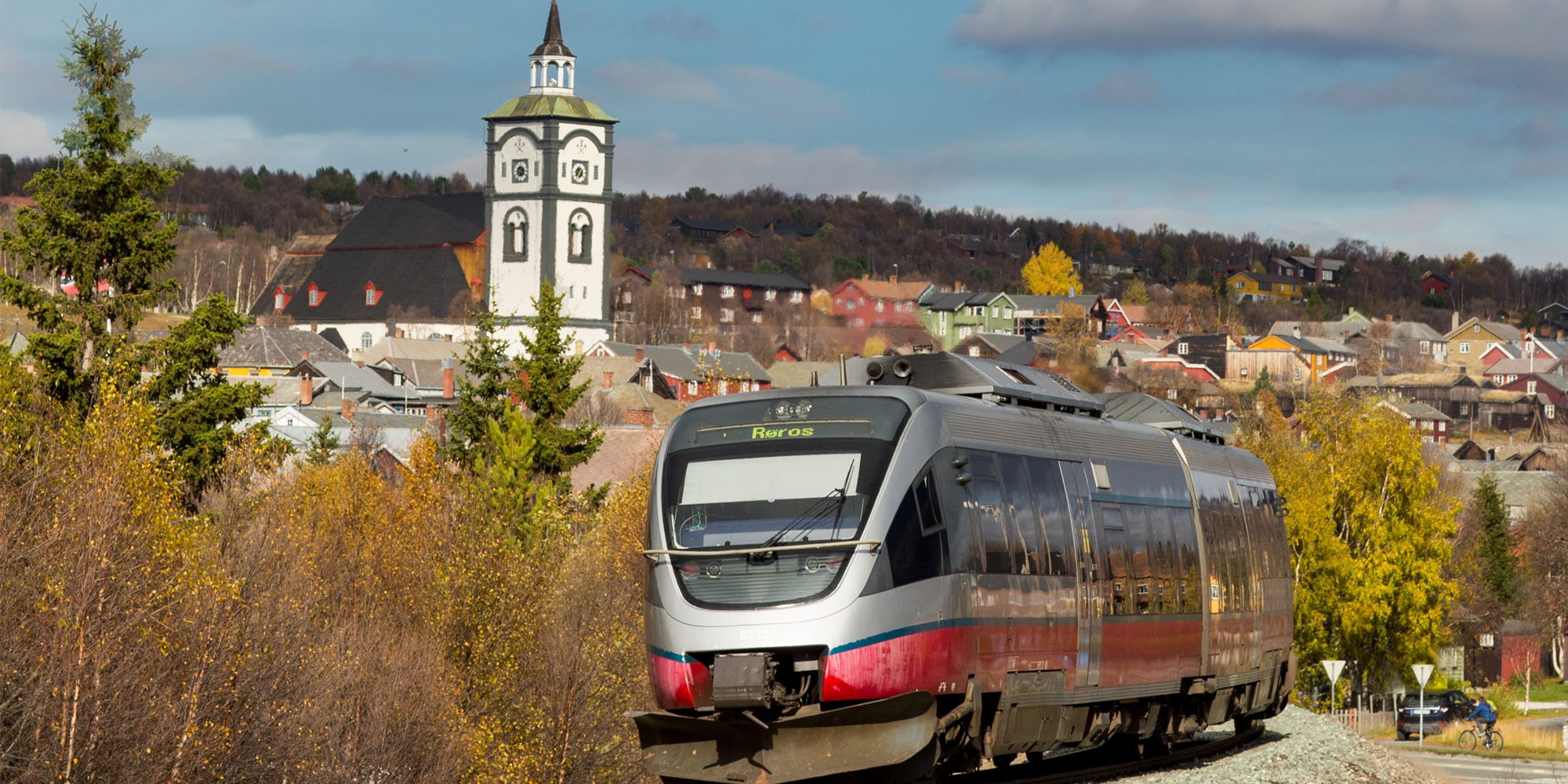A train on the Rørosbanen with a view on the town of Røros, Trøndelag, Norway