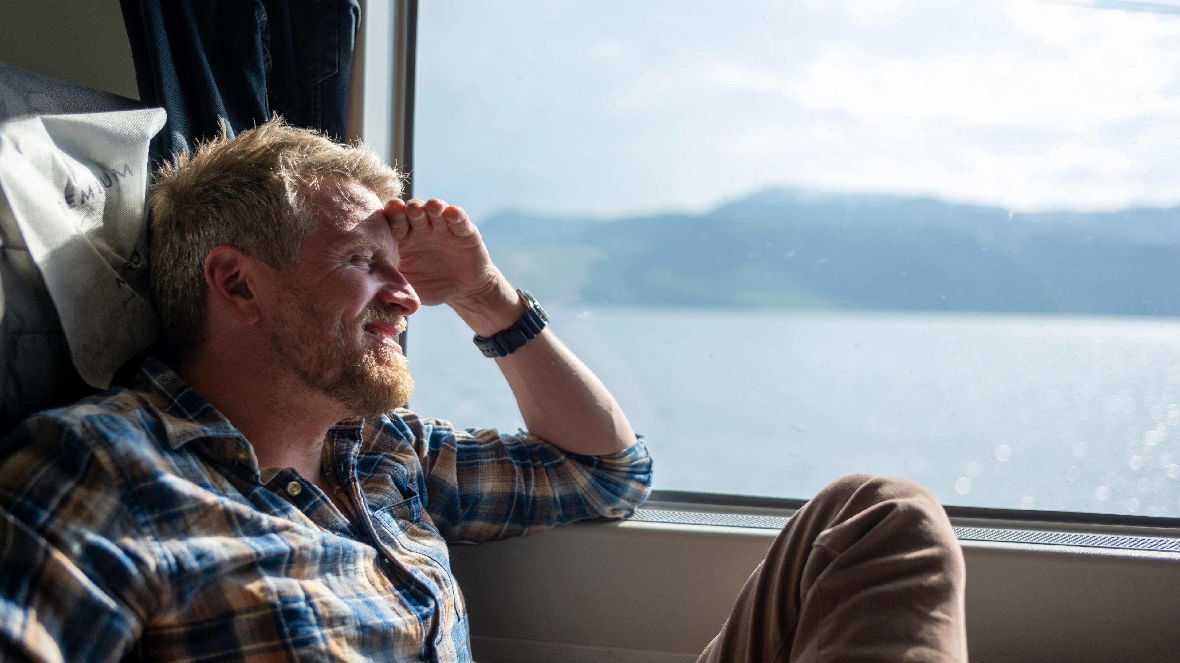 A man on the Nordland line from Trondheim to Bodø, Norway.
