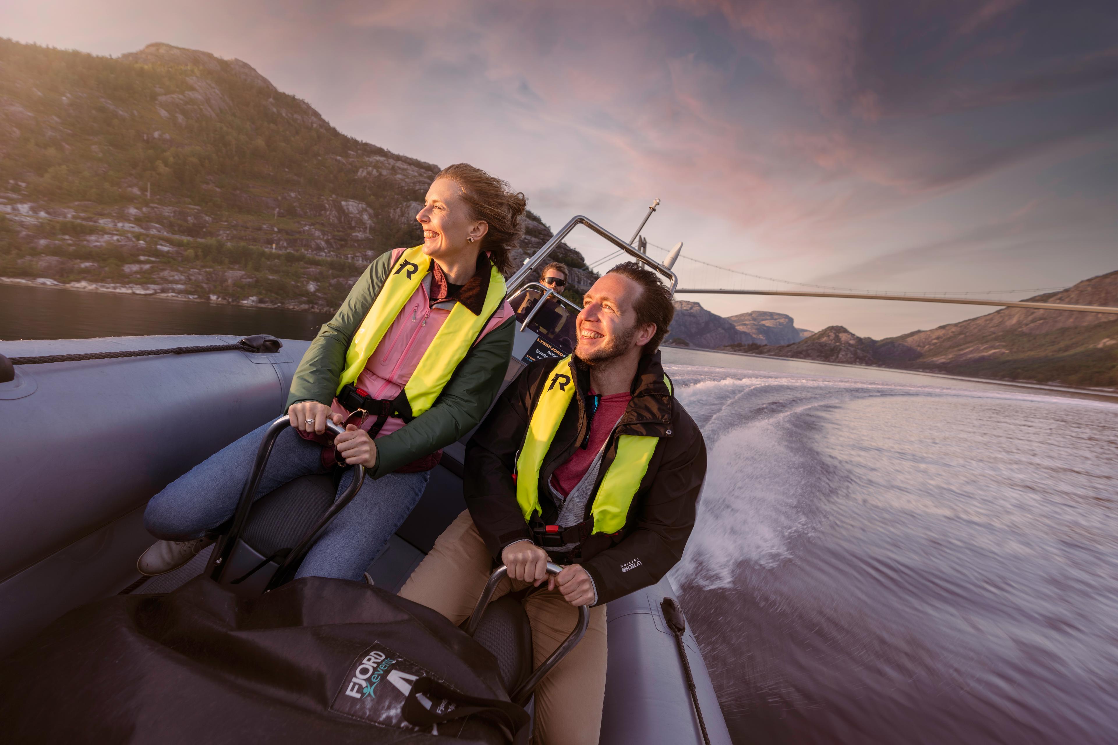 A man and a woman on a RIB boat out on the ocean in Stavanger