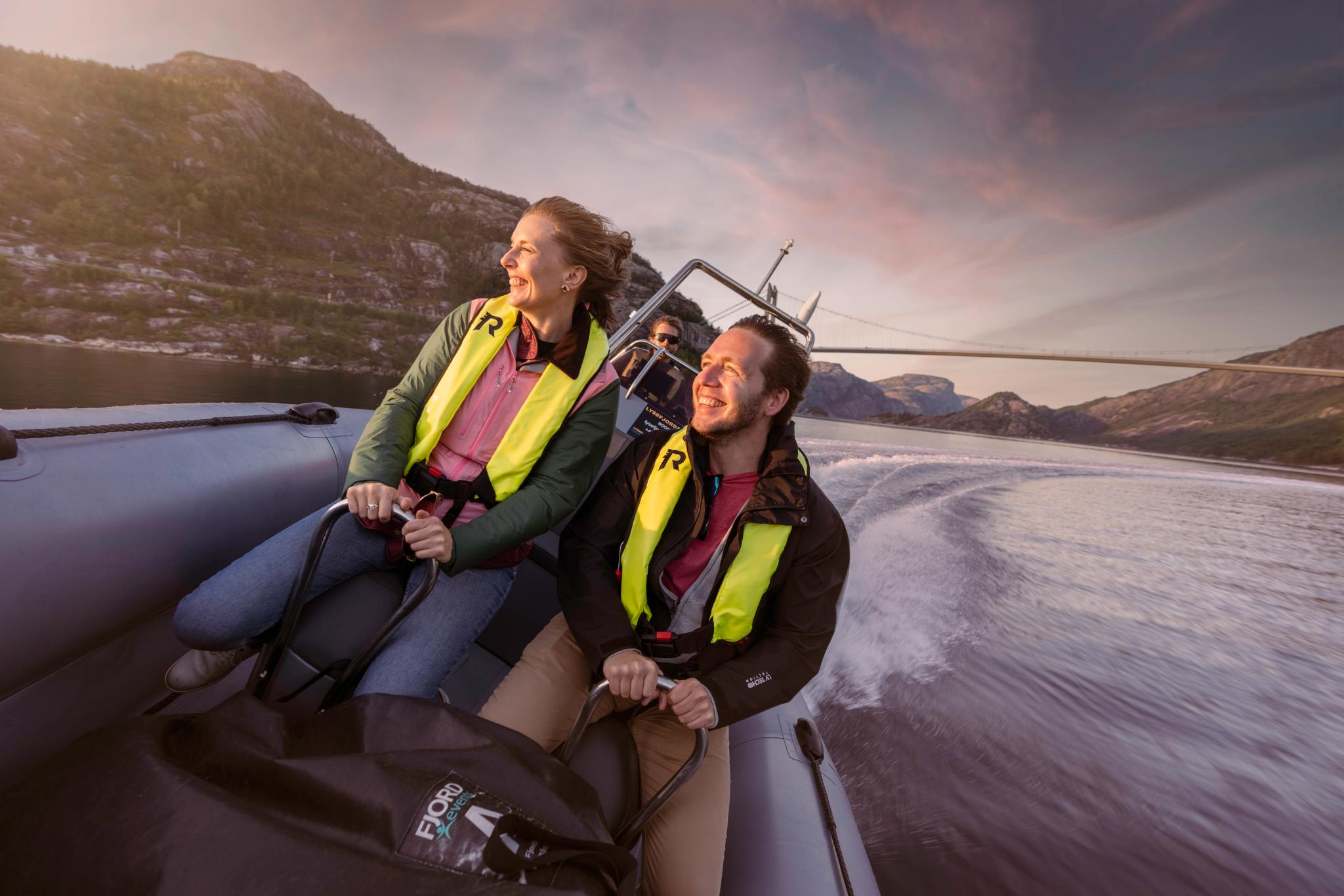 A man and a woman on a RIB boat out on the ocean in Stavanger