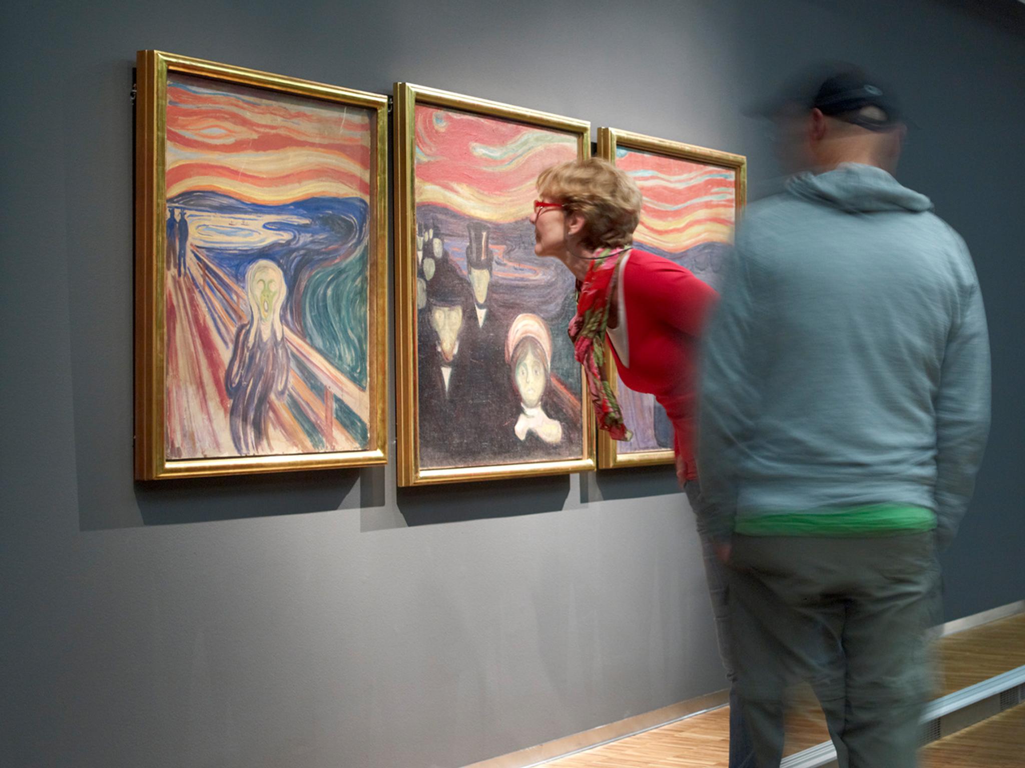 People looking at Edvard Munch’s Scream at The Munch Museum in Oslo