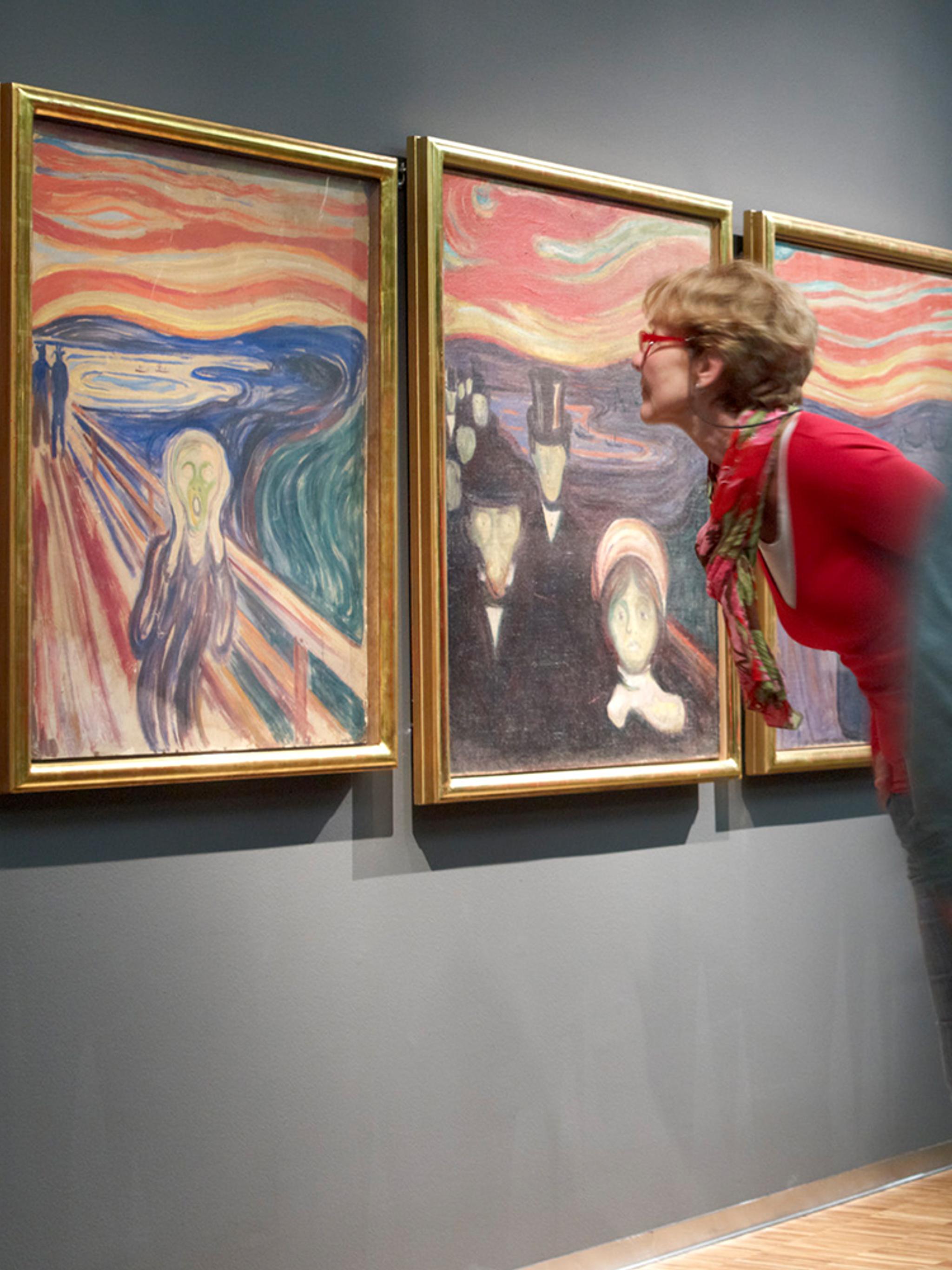 People looking at Edvard Munch’s Scream at The Munch Museum in Oslo