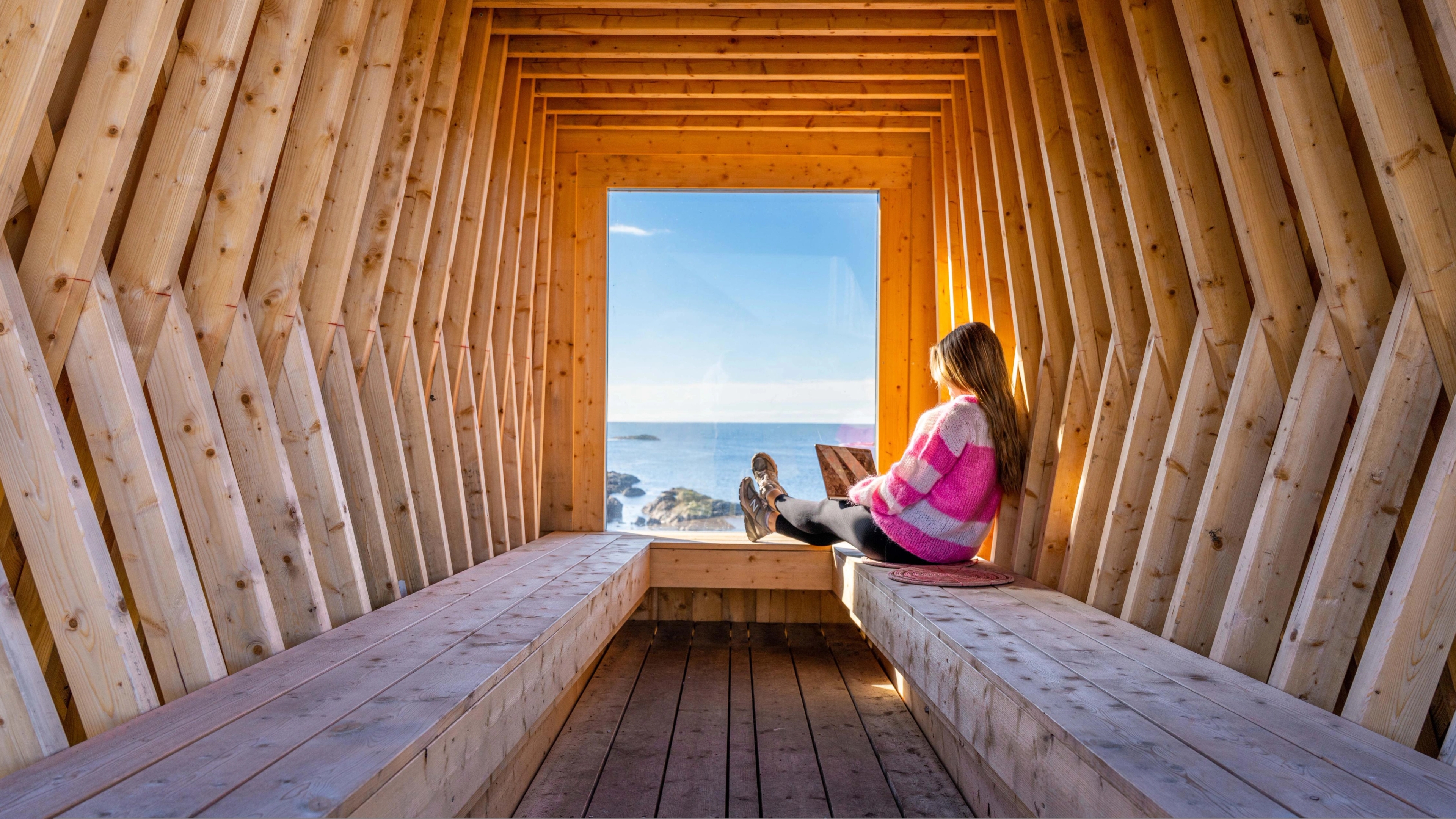 A woman working remotely from Nyksund, in stunning scenery