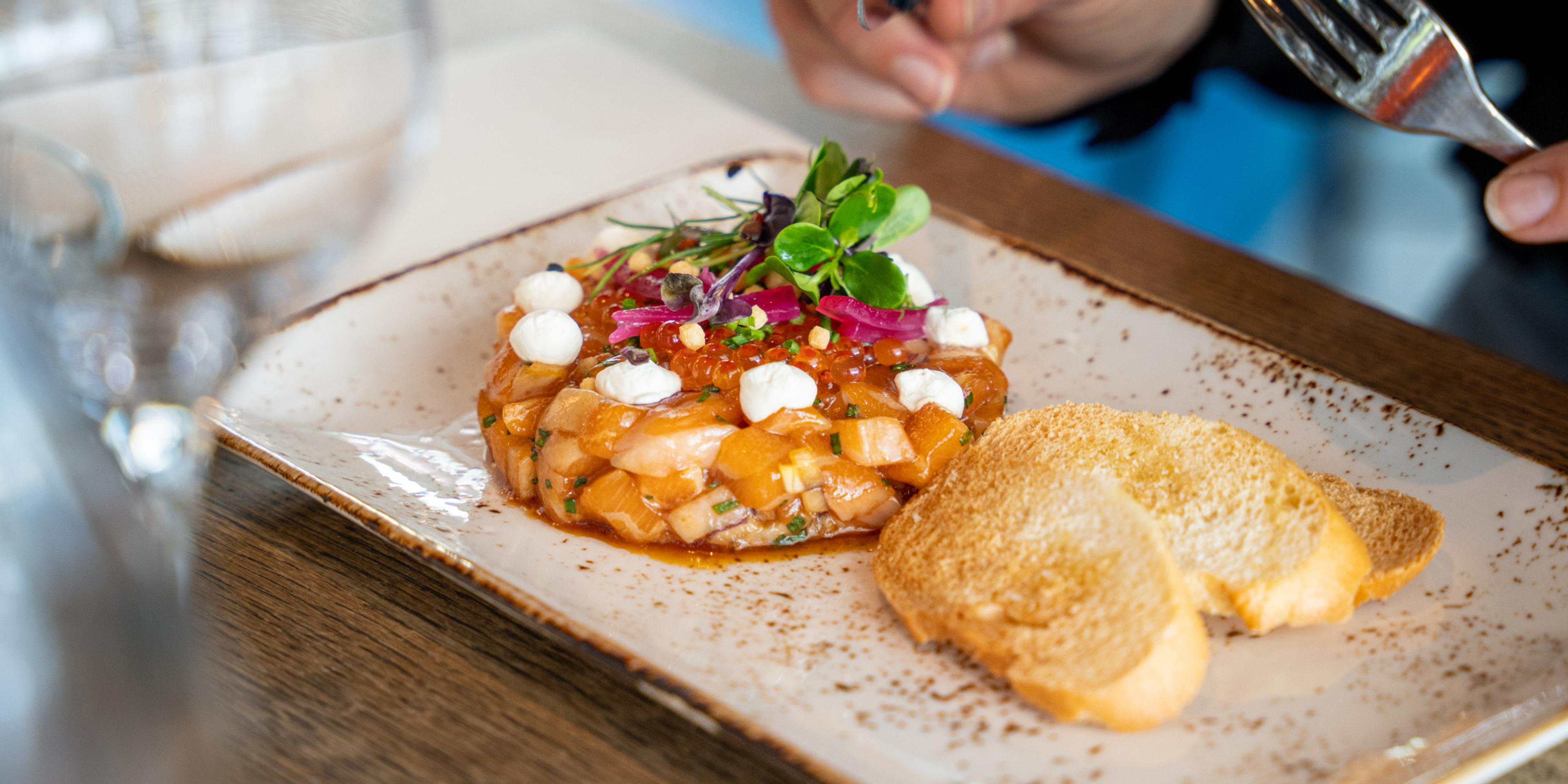 Plate of salmon tartar at The Salmon, Tjuvholmen in Oslo