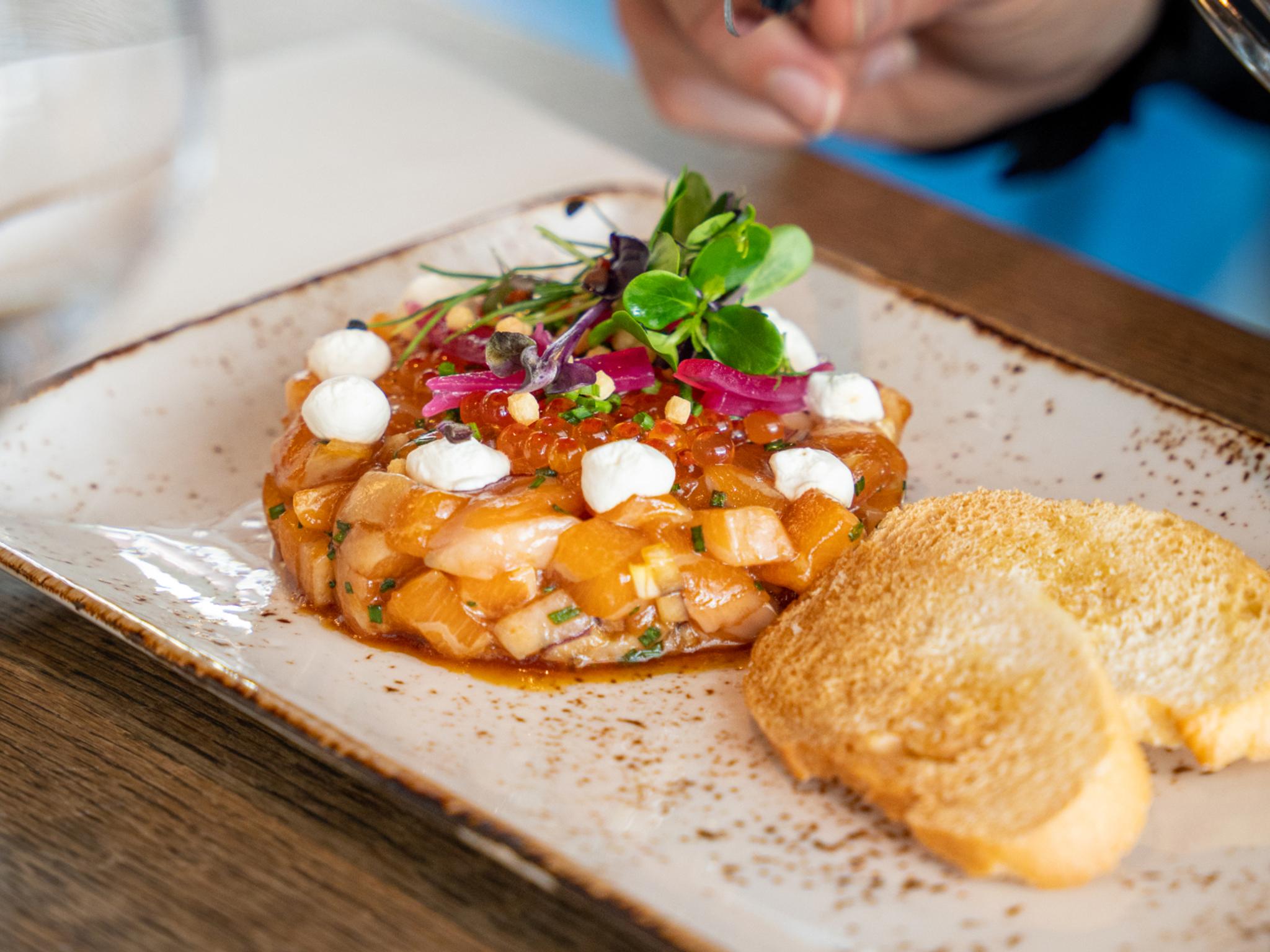 Plate of salmon tartar at The Salmon, Tjuvholmen in Oslo
