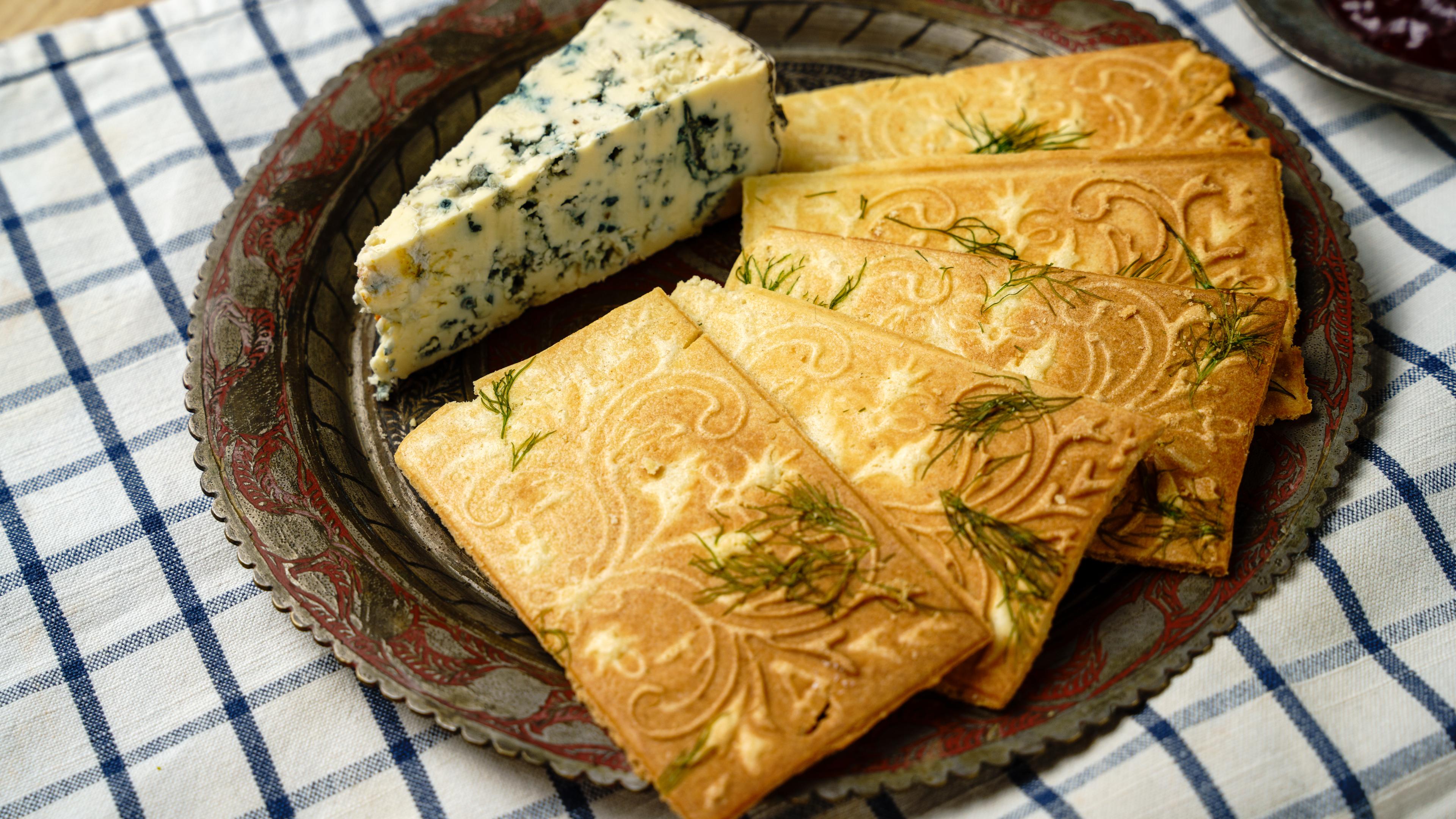 Close-up of goro cookies flavored with dill and blue cheese, showing their traditional patterned shape with a modern savory twist