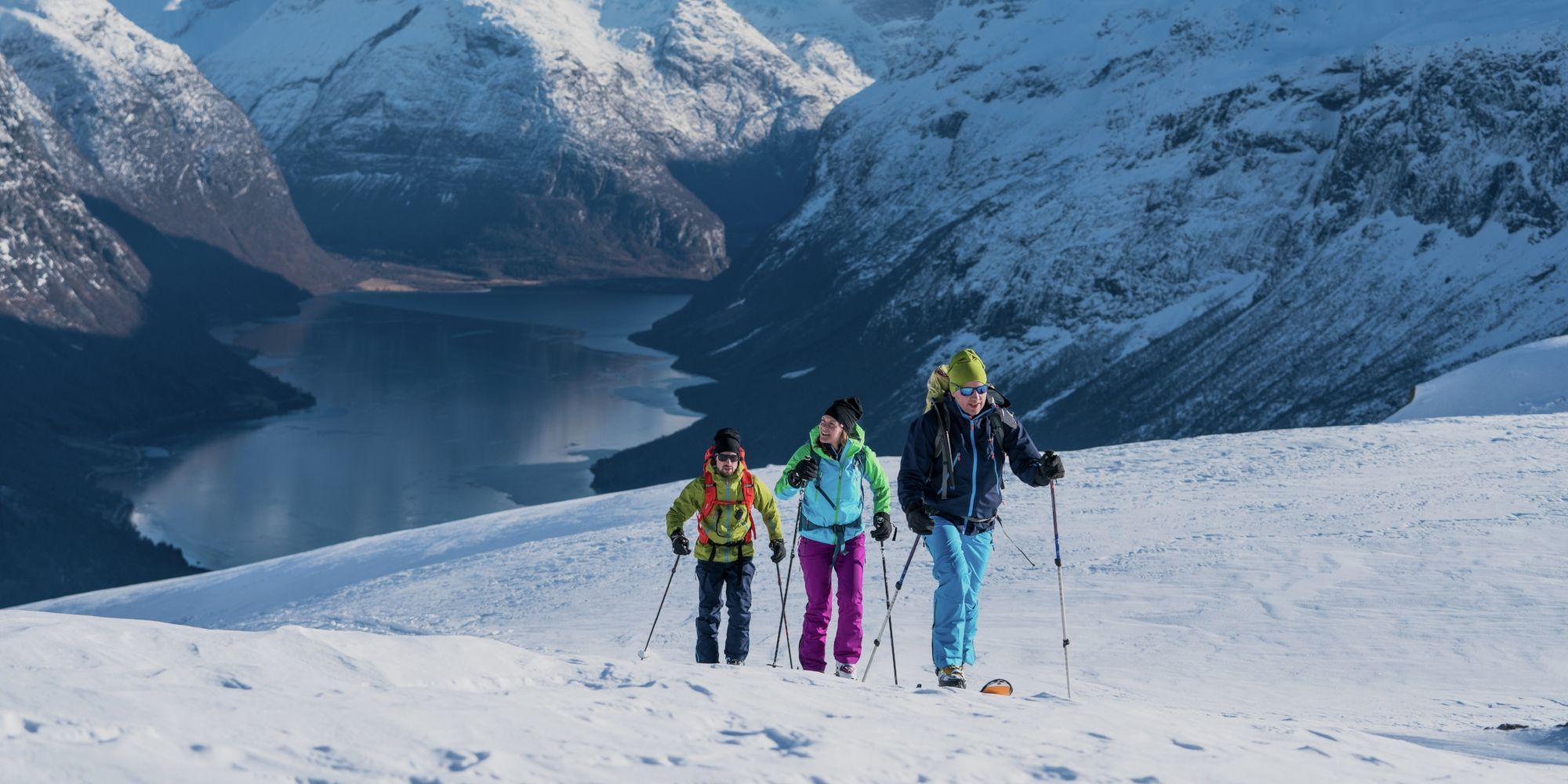 Three people ski touring at Mount Hoven in Loen in Nordfjord, Fjord Norway