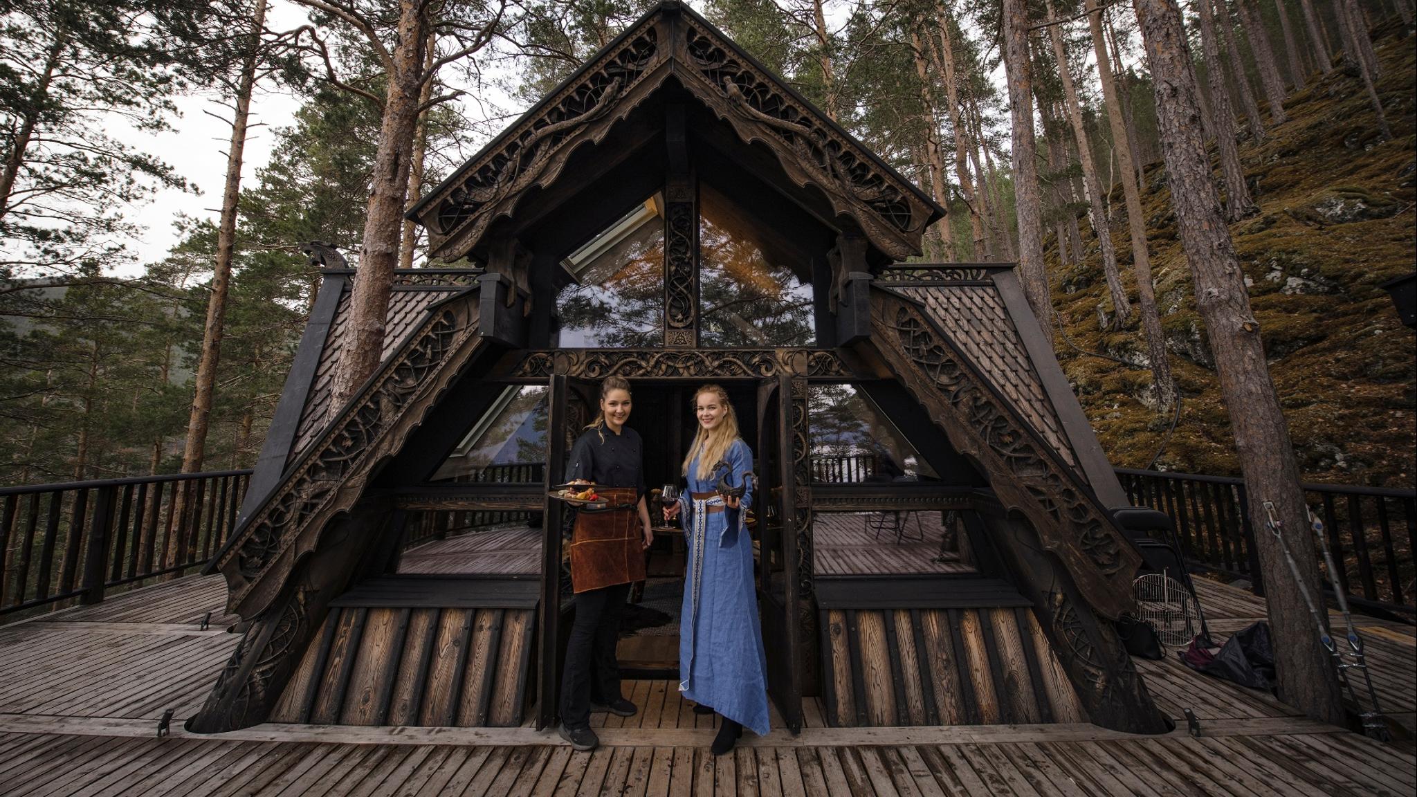 Two women dressed as vikings, in a three top cabin inspired by norse mythology in Fjord Norway