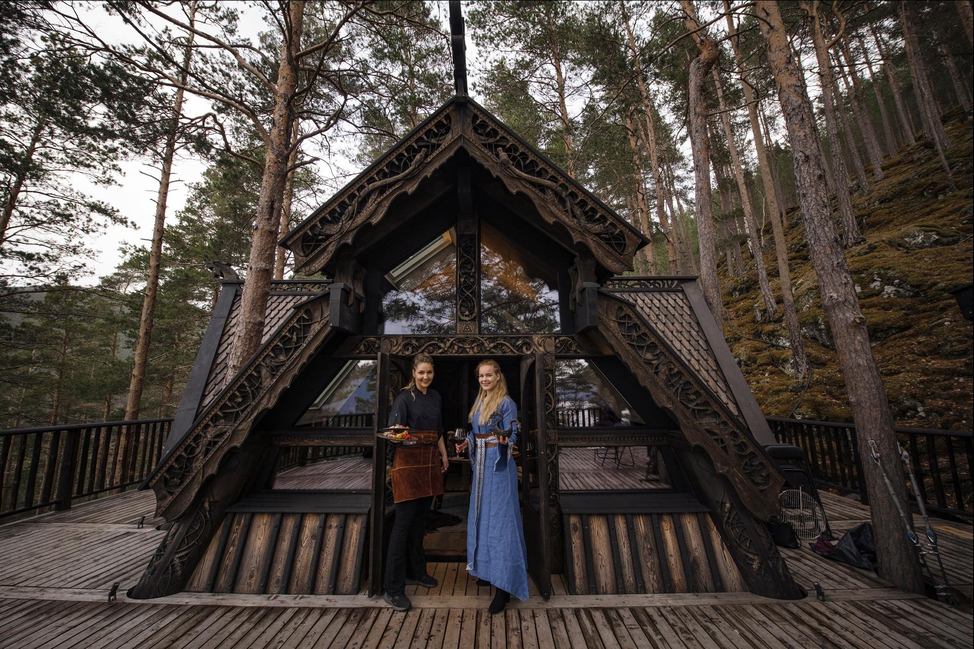 Two women dressed as vikings, in a three top cabin inspired by norse mythology in Fjord Norway