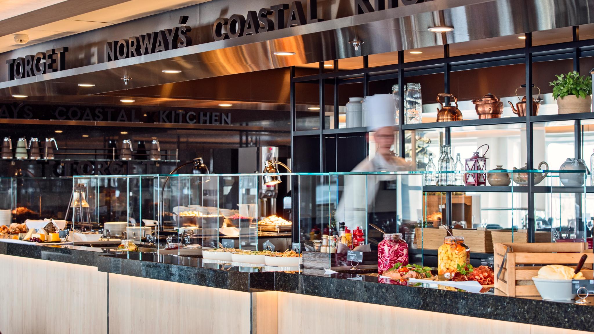 A chef preparing a buffet on Hurtigruten