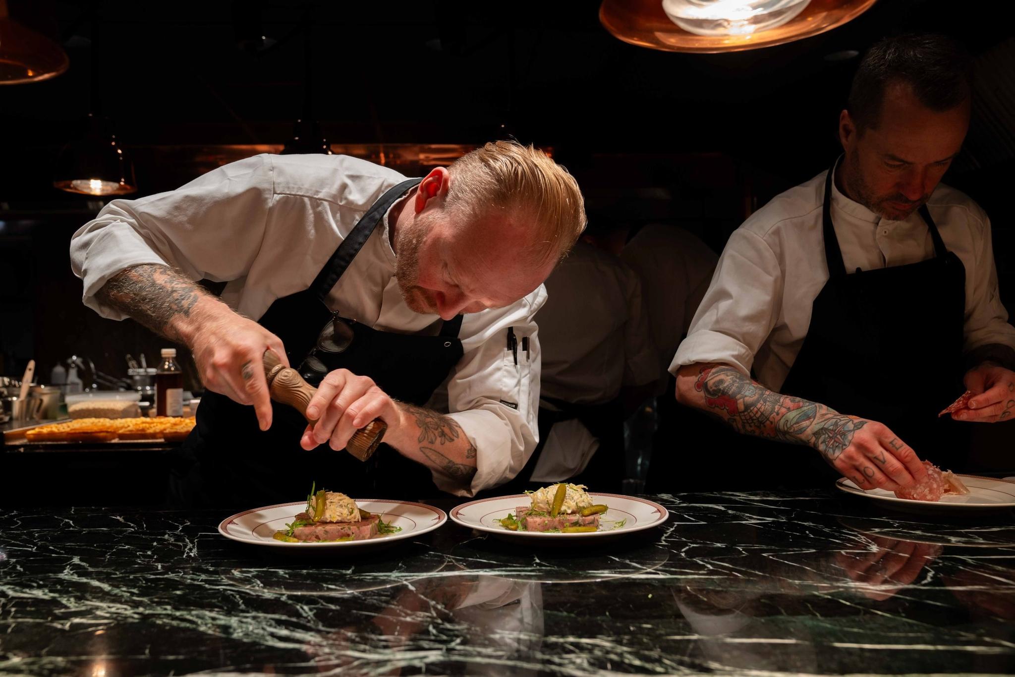 Chefs plating gourmet dishes