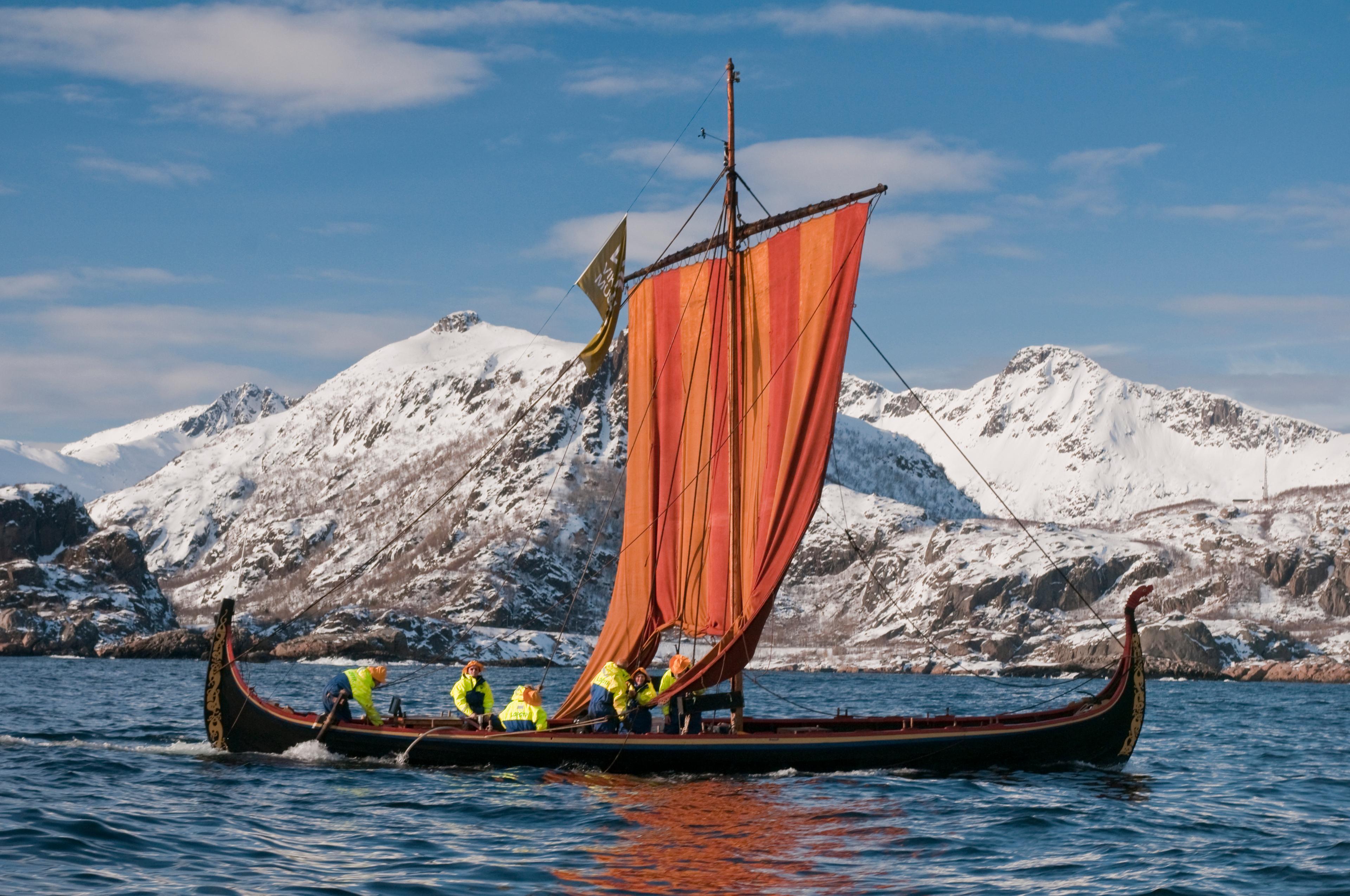 Six people in an old Viking ship in Lofoten in Northern Norway