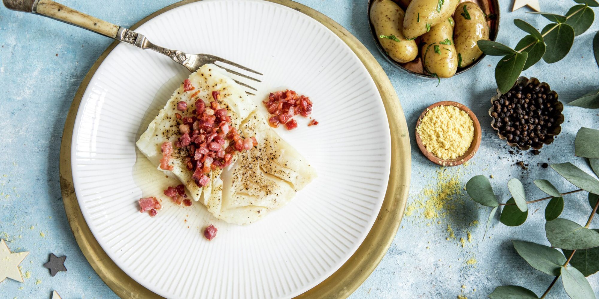 A plate of lutefisk and bacon served with potatoes