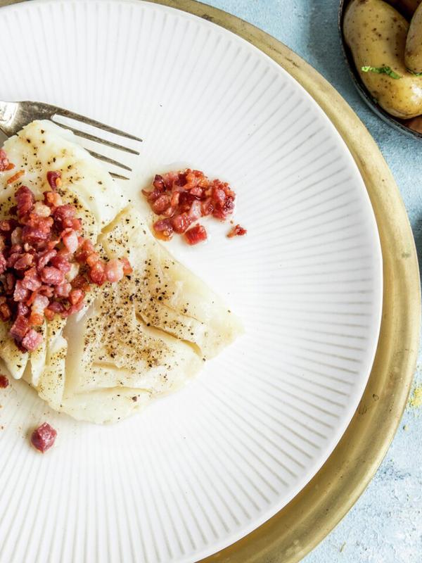 A plate of lutefisk and bacon served with potatoes