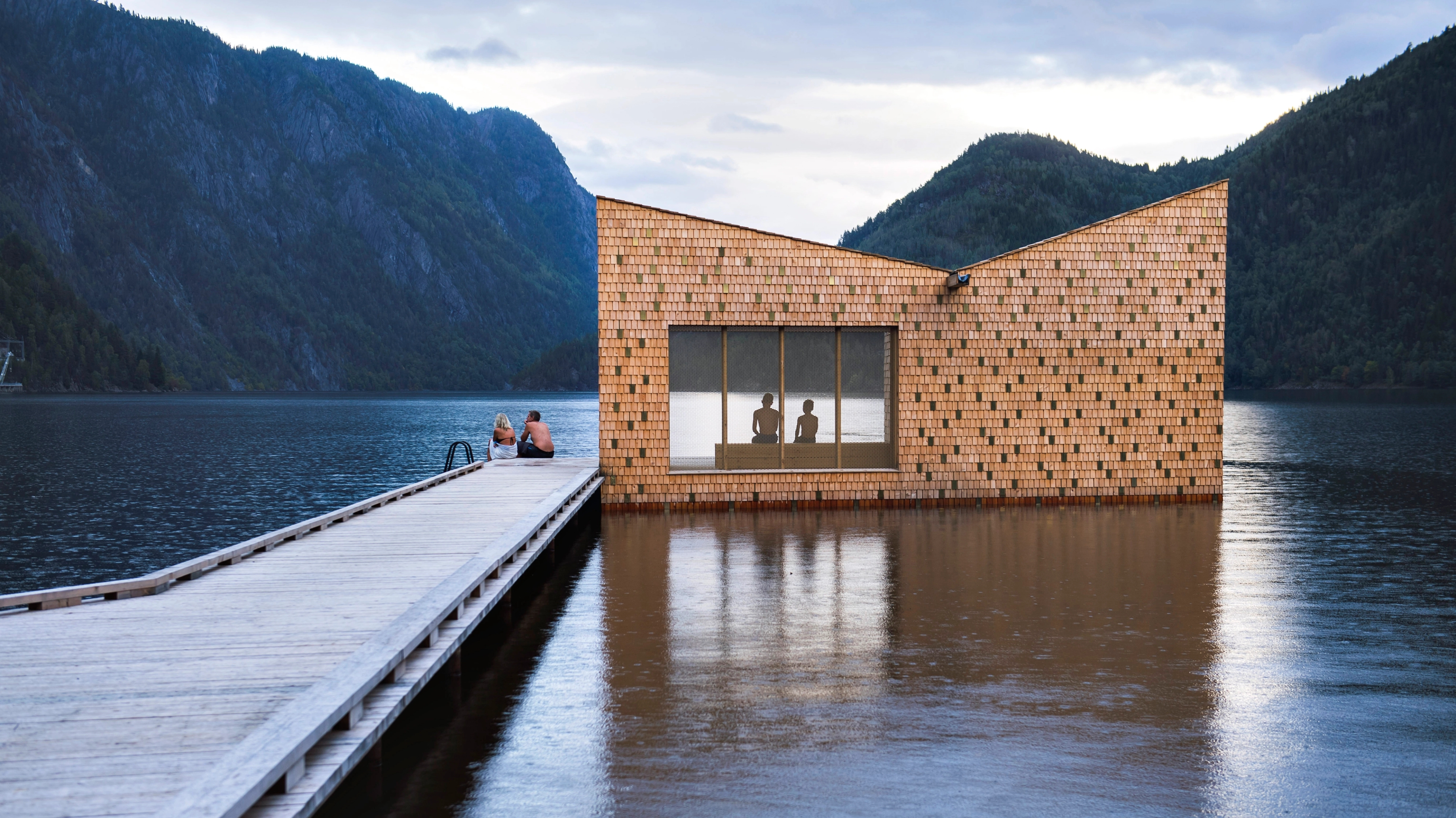 People enjoying the floating Soria Moria sauna in Telemark
