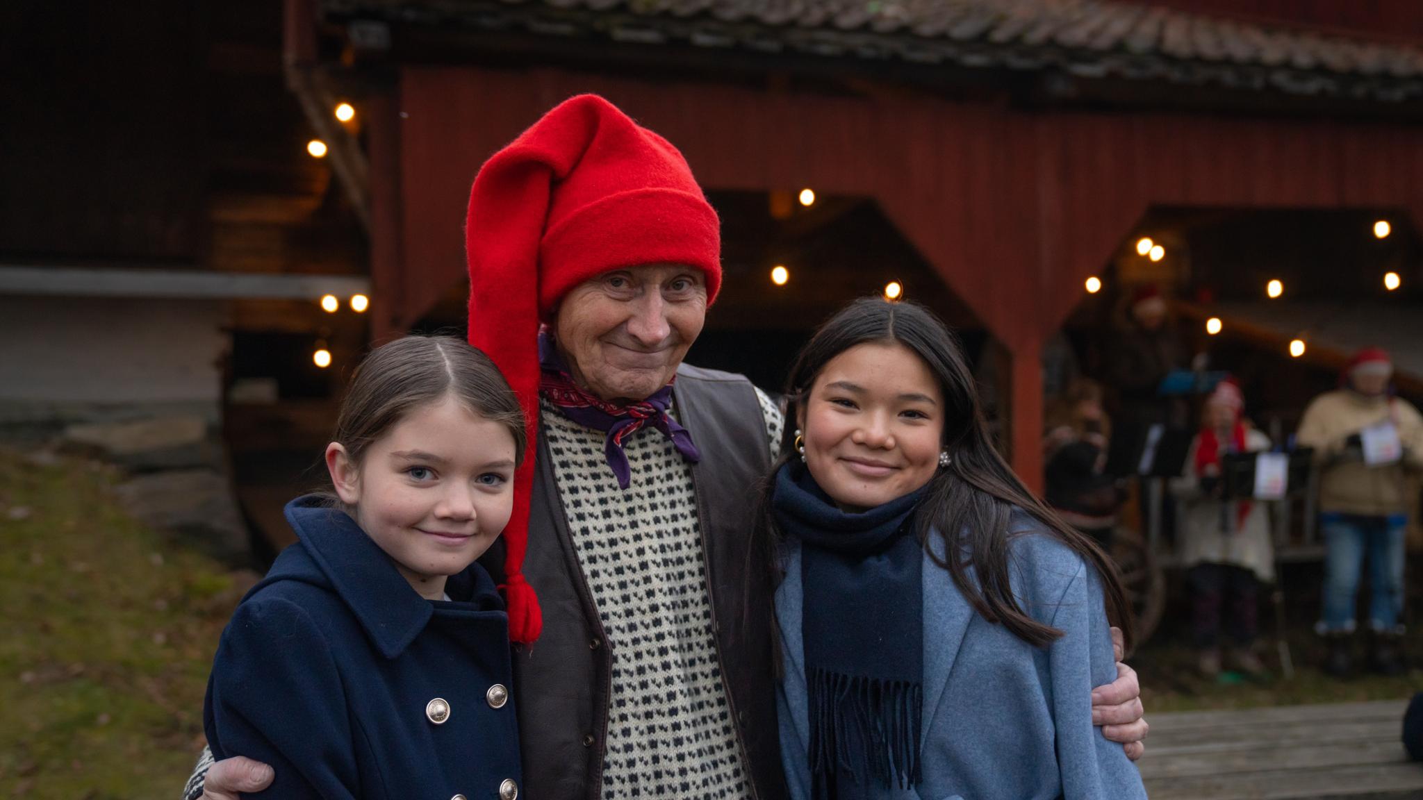 The Norwegian Santa and two girls at the Christmas market at Norsk Folkemuseum in Bygdøy, Eastern Norway