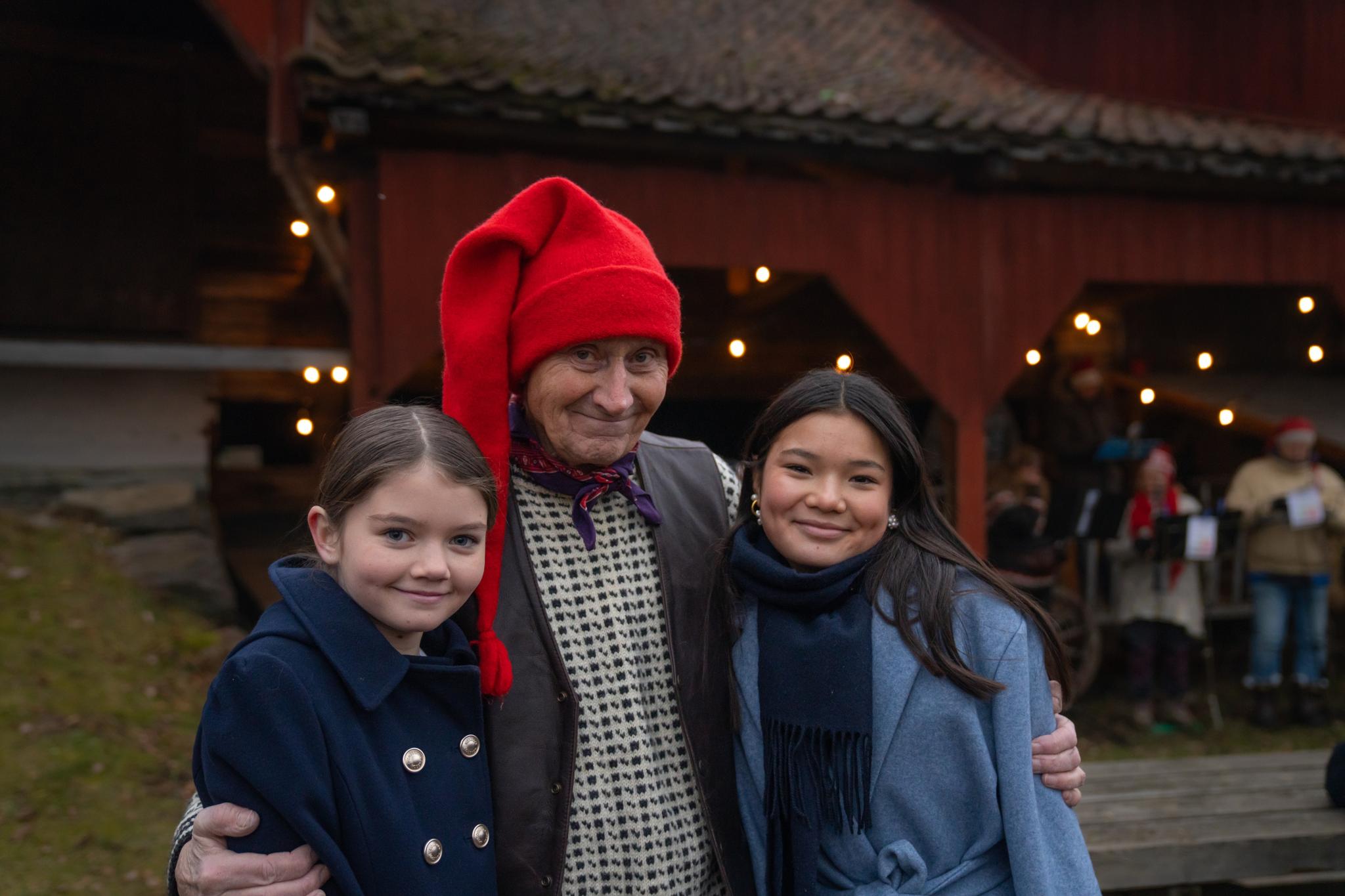 The Norwegian Santa and two girls at the Christmas market at Norsk Folkemuseum in Bygdøy, Eastern Norway