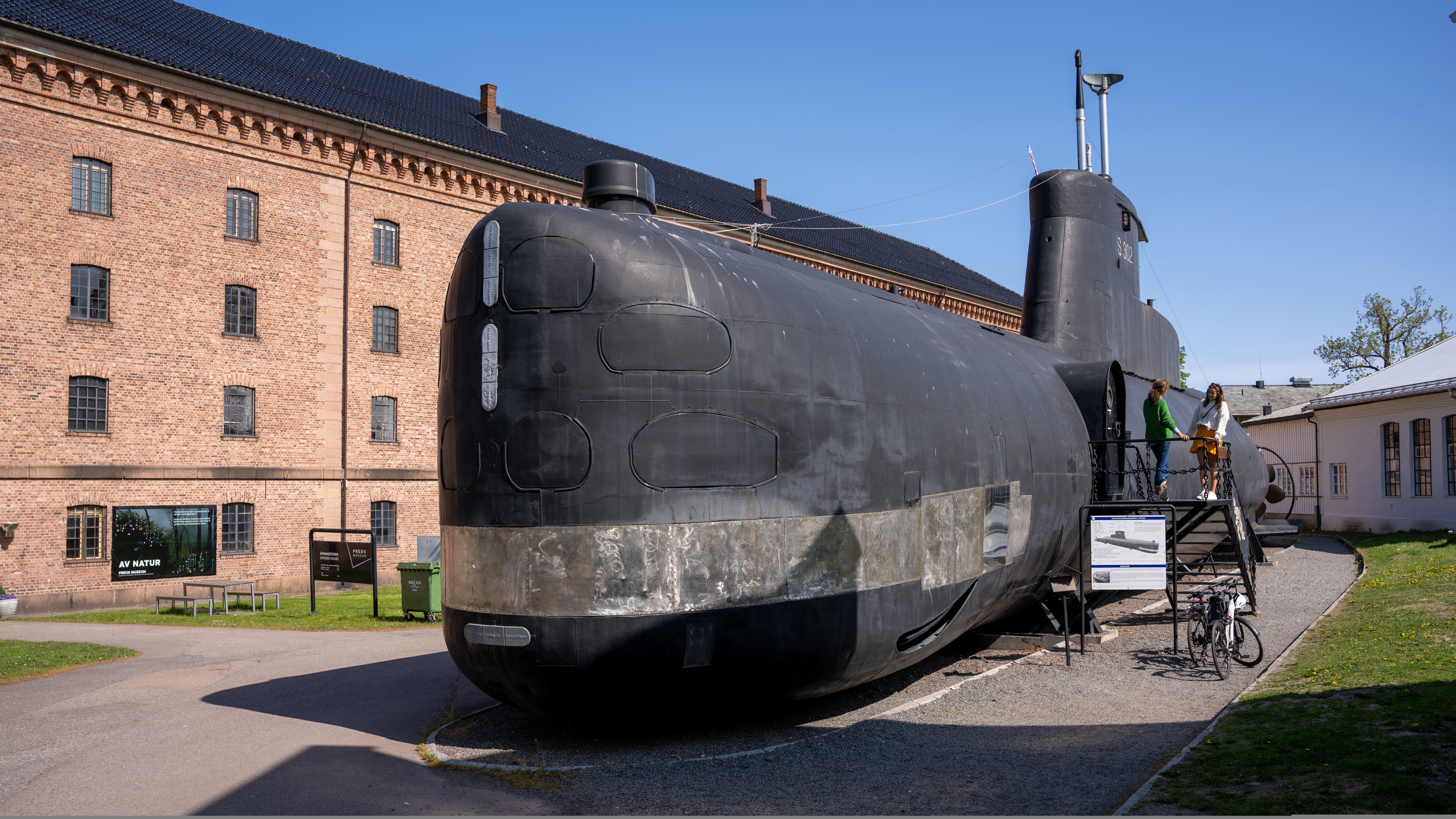 A large black submarine on land