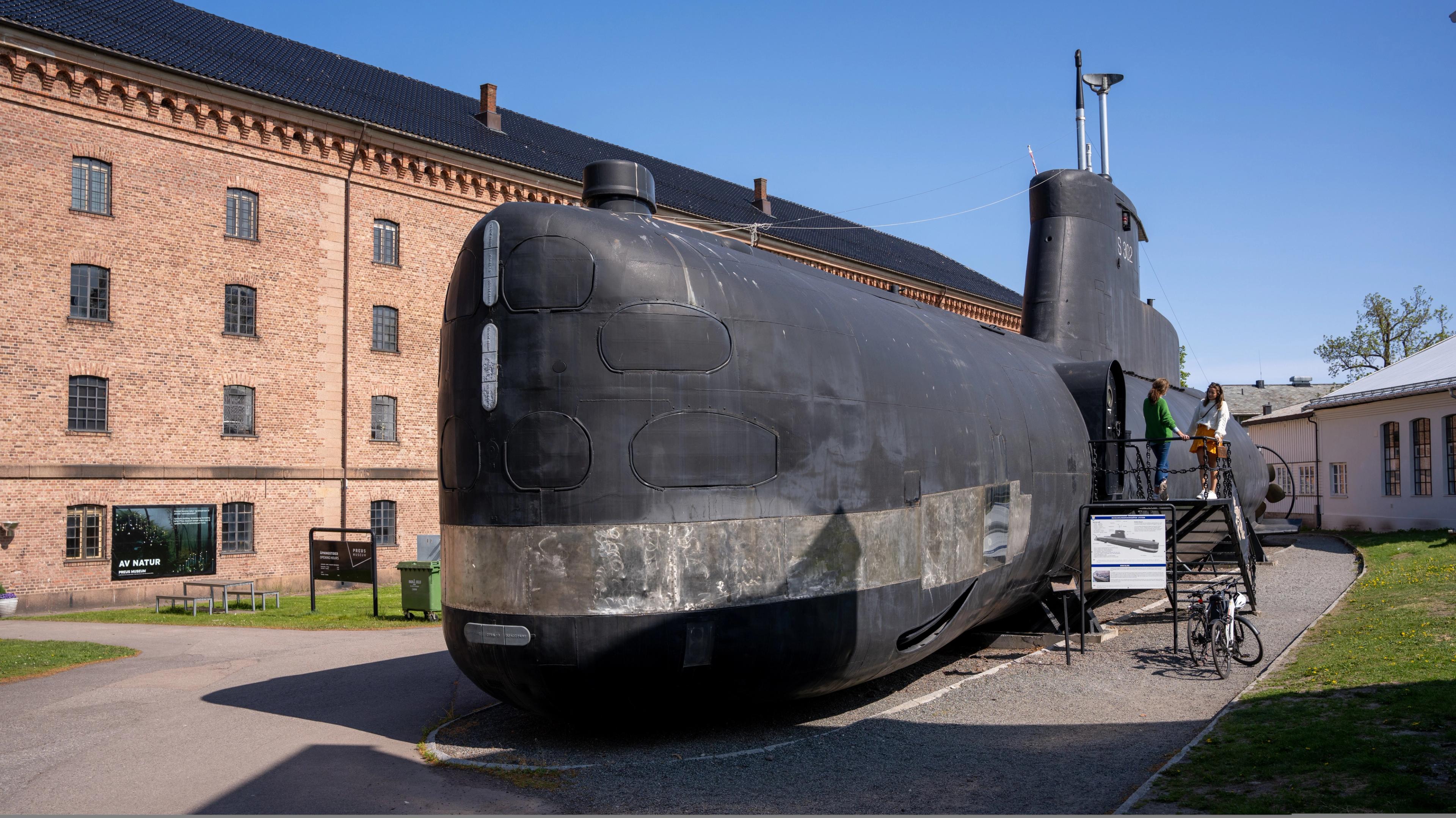 A large black submarine on land