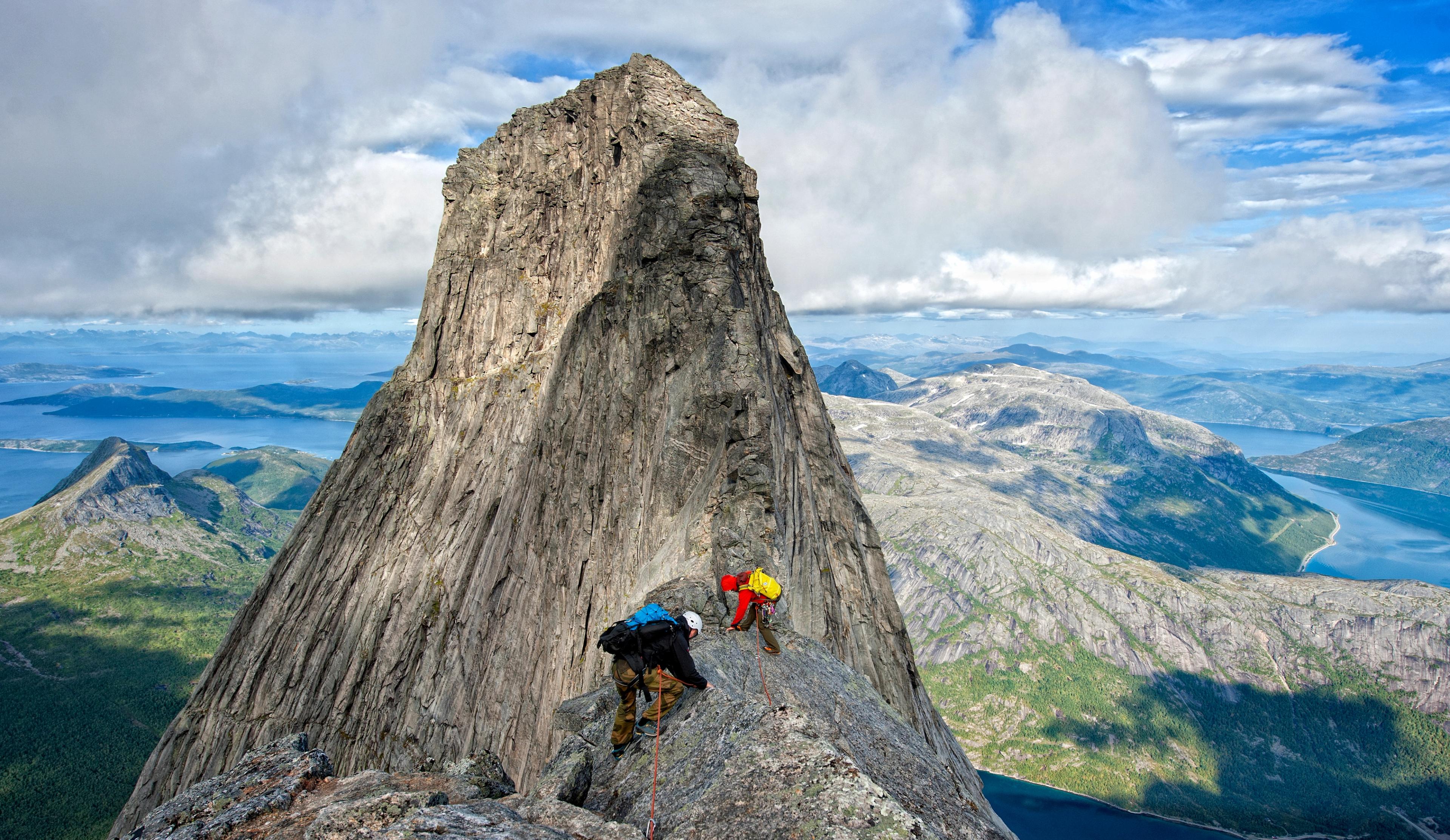 Two people climbing Stetinden in Narvik, Northern Norway
