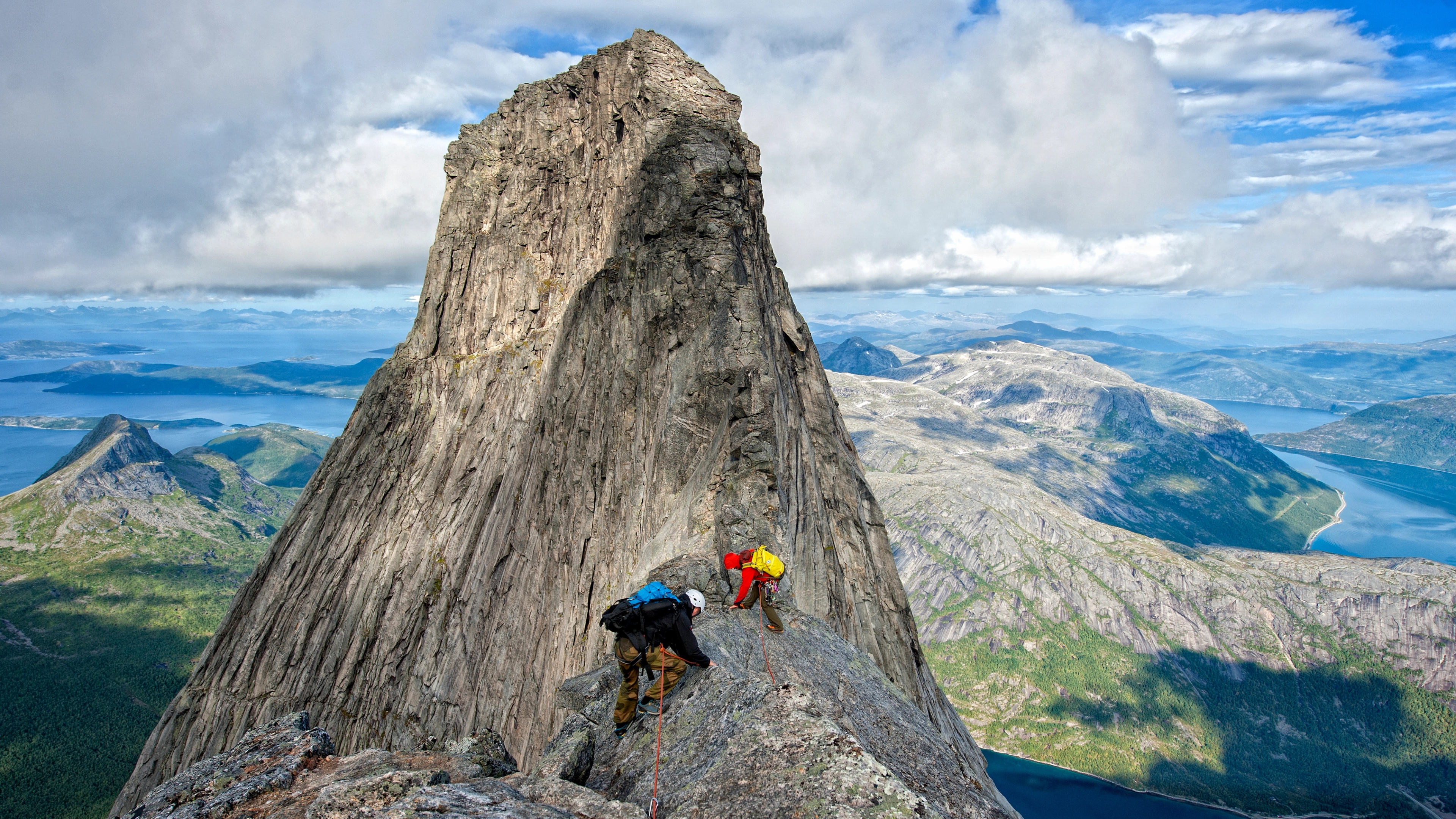 Two people climbing Stetinden in Narvik, Northern Norway