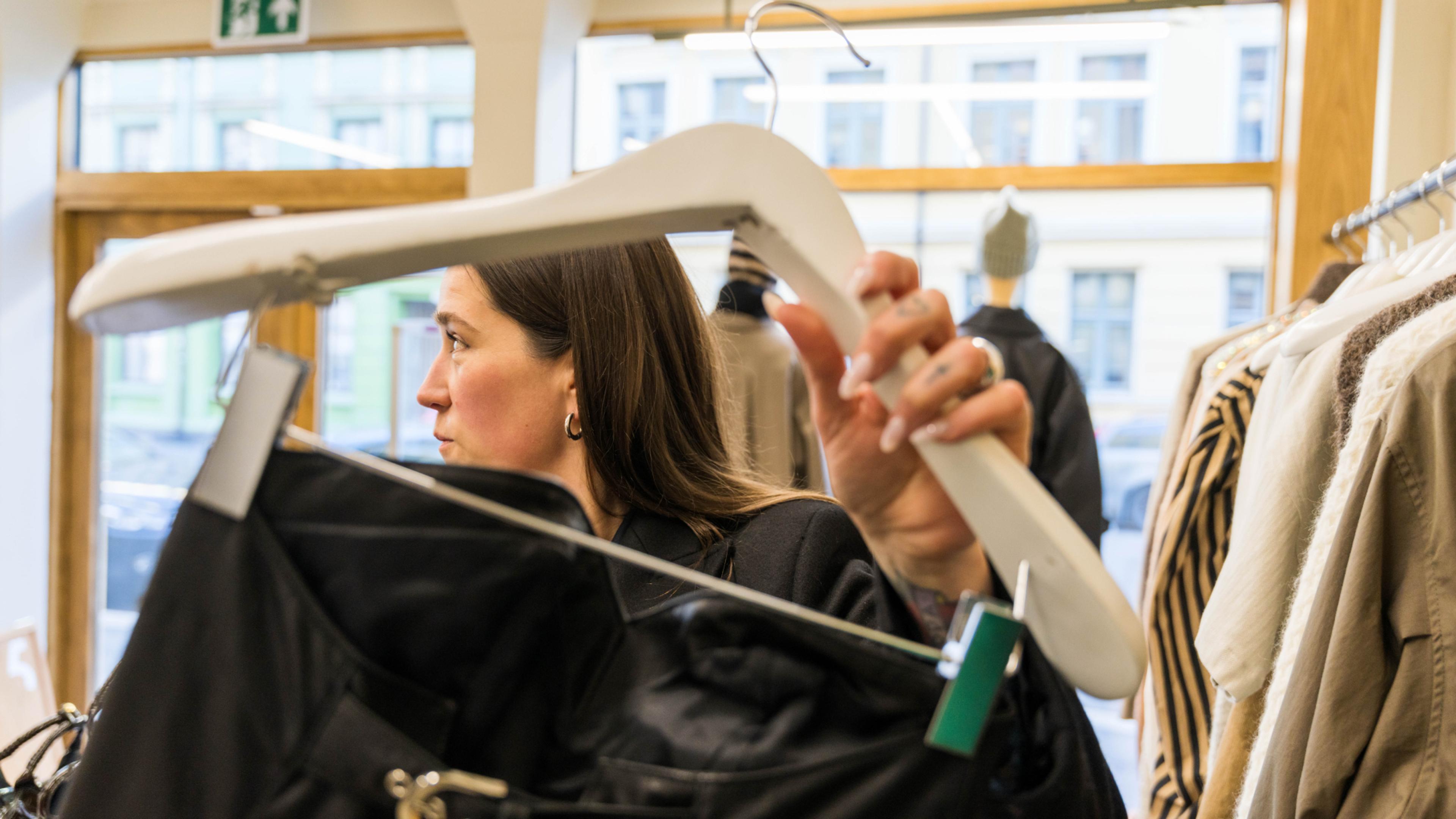 Ida Elise Eide Einarsdottir looking at Norwegian fashion at the F5 store in Oslo