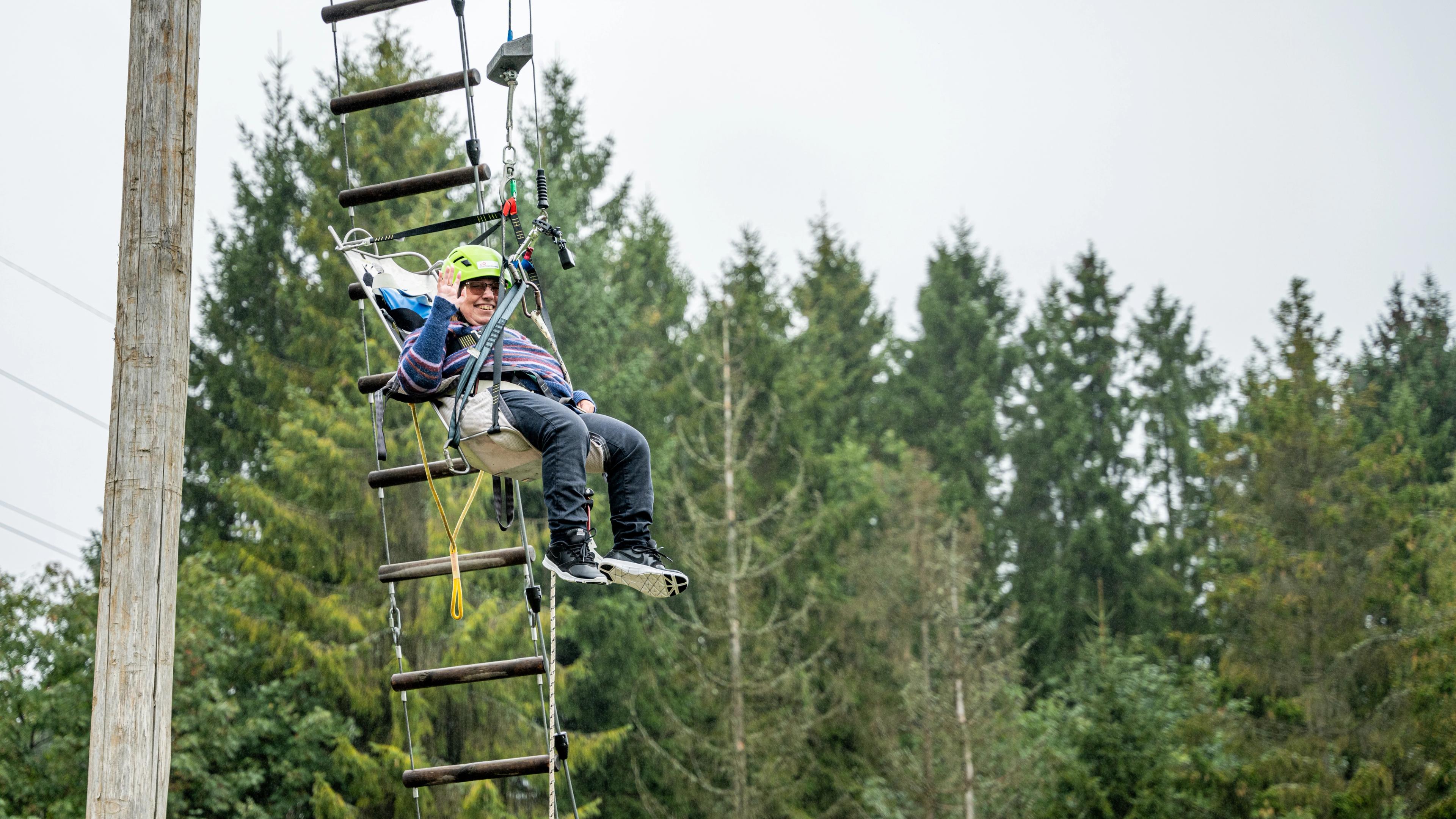 Woman tries accessible zip line in Skien Fritidspark, Telemark