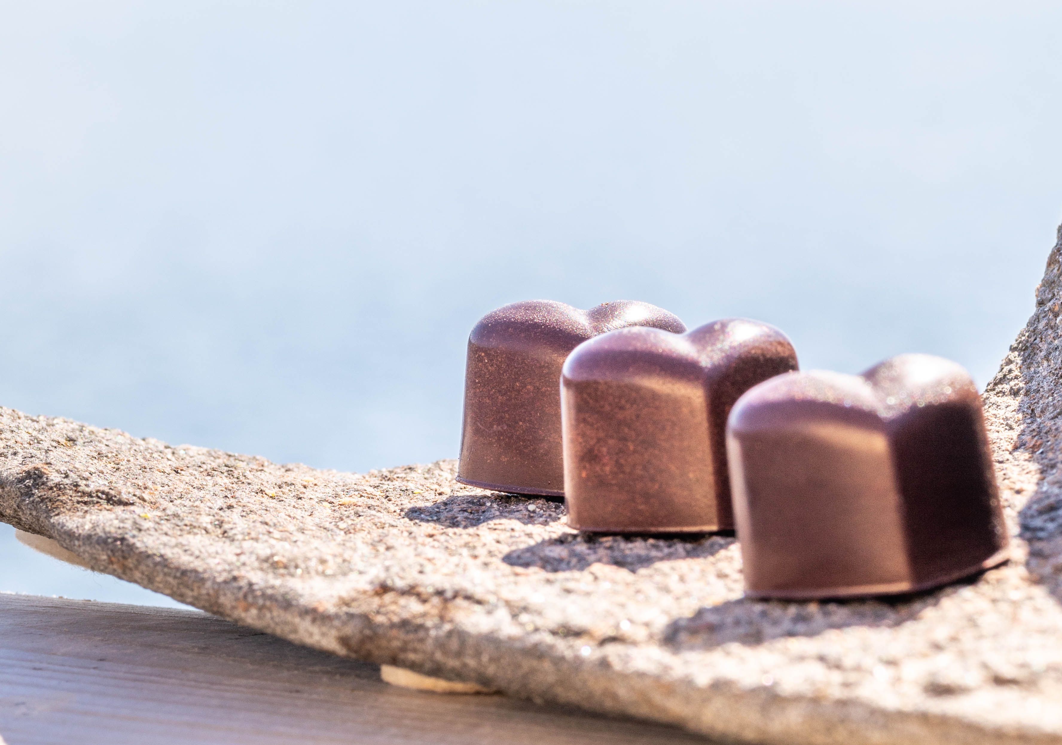 Chocolate confect and coffee.