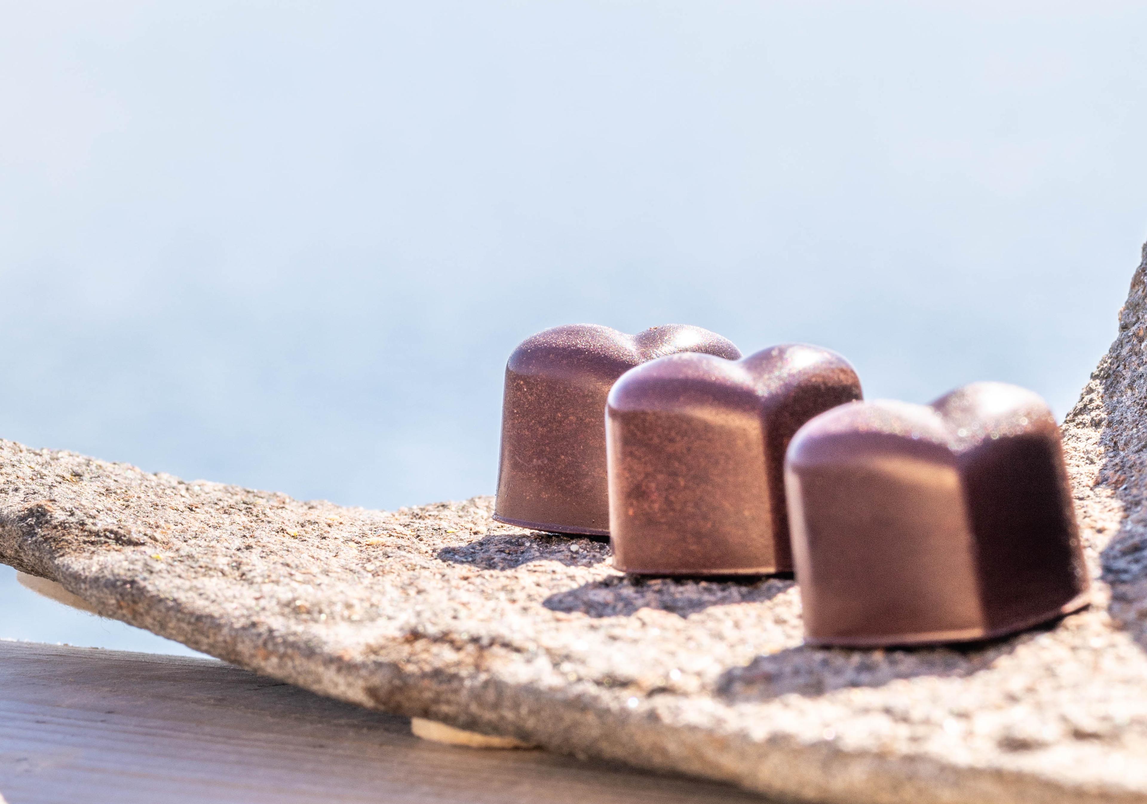 Chocolate confect and coffee.