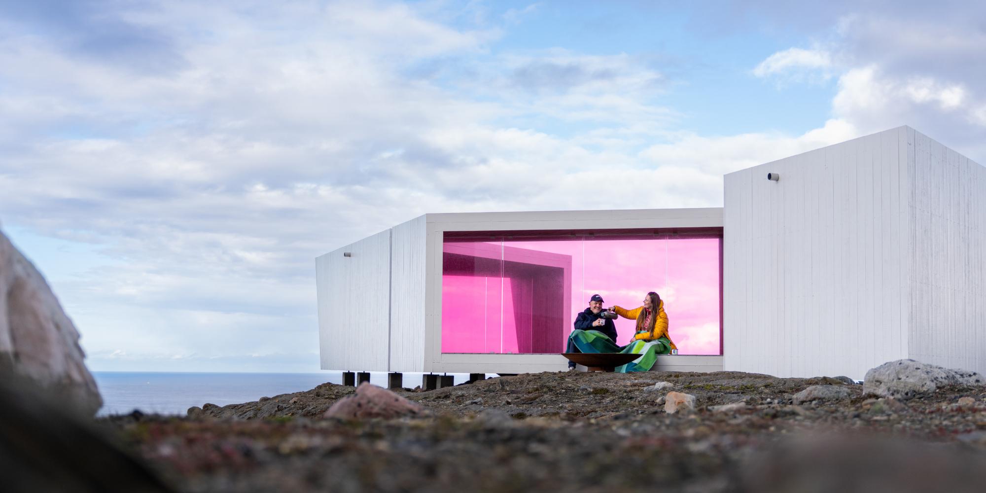 Two poeple sitting in Domen viewpoint by Biptope in Varanger, Northern Norway