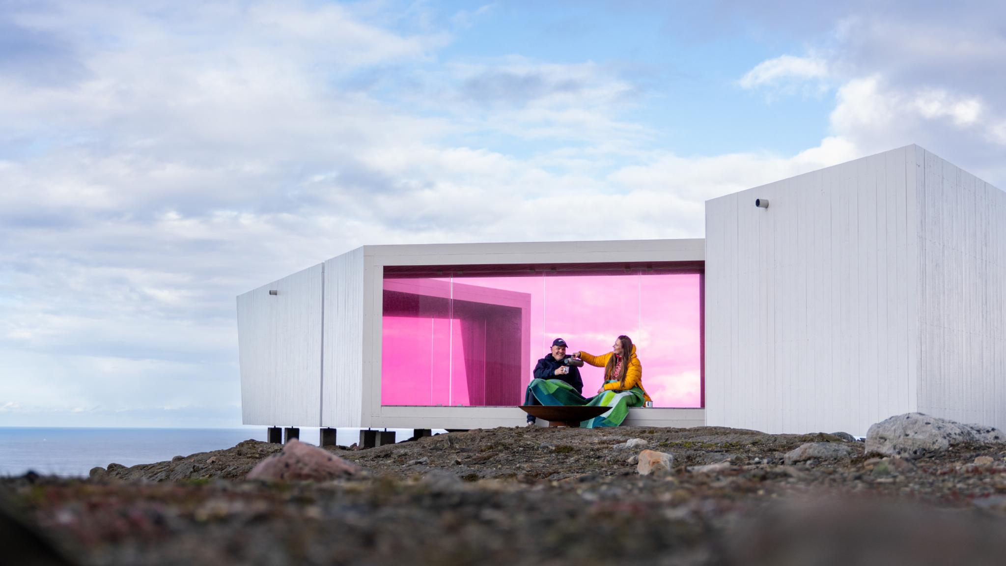Two poeple sitting in Domen viewpoint by Biptope in Varanger, Northern Norway