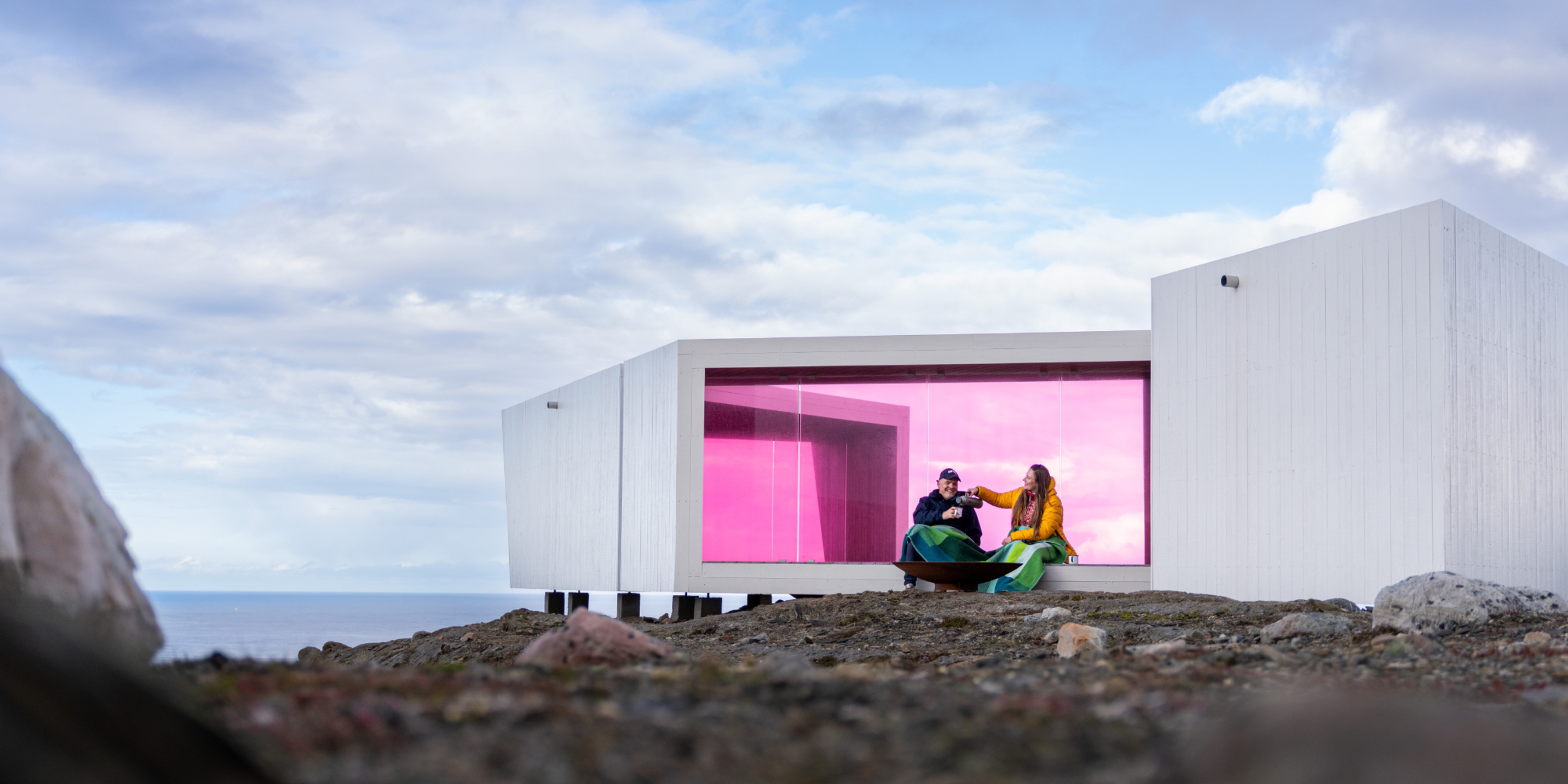 Two poeple sitting in Domen viewpoint by Biptope in Varanger, Northern Norway