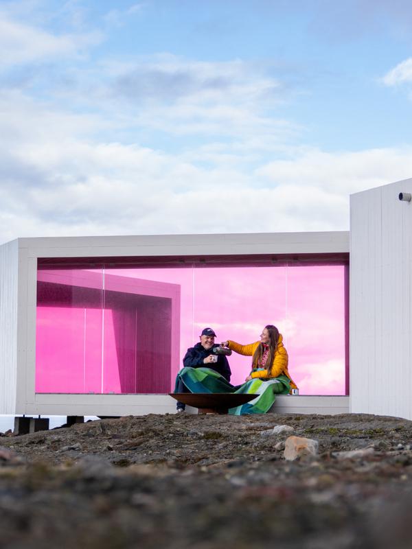 Two poeple sitting in Domen viewpoint by Biptope in Varanger, Northern Norway